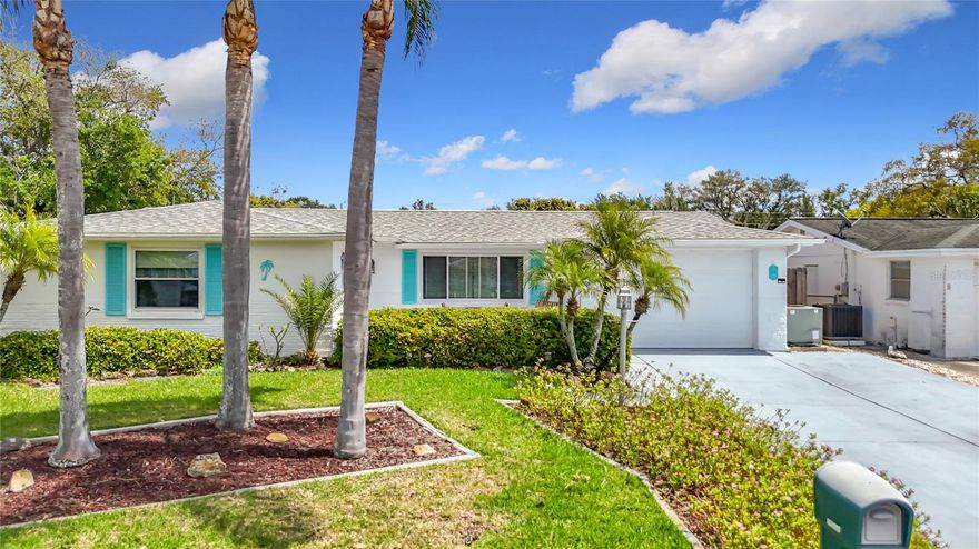 This charming 2-bedroom, 2-bathroom home is situated in a well-established neighborhood, offering both comfort and convenience close to shopping, dining, and schools. As you approach, you’ll appreciate the beautifully landscaped front yard and the extended concrete driveway, which provides plenty of parking and leads to a welcoming, cozy front porch. Inside, the open floor plan features a spacious living room and dining room combo, seamlessly connecting to the family room that can easily serve as a third bedroom if needed. The kitchen boasts ample cabinets and generous counter space, ideal for meal preparation and entertaining guests. The master bedroom is generously sized, complemented by a master bath with a tile shower. The second bedroom is roomy, and the second bathroom ensures convenience for guests or family members. A dedicated laundry room includes a washer, dryer, plenty of cabinets and counter space for extra storage, and an additional refrigerator. There’s also a separate vinyl-enclosed room with storage cabinets, perfect for hobbies or extra organization or easy 3rd bedroom. Recent updates include a roof replacement in 2022, updated AC system, newer water heater, and a sprinkler system on a well with a new tank and pump. The property is fully fenced and features mature loquat, banana, and magnolia trees, as well as pineapple plants, enhancing the outdoor living space with beauty and privacy. Oversized garage with lots of cabinets and workbench. This home has been well maintained and move-in ready. Minutes from US 19 and Close to the Suncoast parkway for quick access to the airport, Tampa, Clearwater and St. Pete Beaches (Ranked in the top 5 Beaches in the US), also close to SunWest Park…an outdoor recreation water park, beach, swimming and gorgeous sunsets, Homosassa Springs, the famous Weeki Wachee live mermaids and Tarpon Springs Sponge Docks. Short drive to beautiful downtown New Port Richey…a historic Rivertown community in north Tampa Bay with award-winning restaurants, shops, bars, and breweries. Its rich history is preserved by the Hacienda Hotel, Richey Suncoast Theatre, and the New Port Richey Museum. Natural amenities like Sims Park, the Cotee River, and James E. Grey Preserve are waiting to be explored. NO CDD, NO HOA FEES, NO FLOOD INSURANCE.