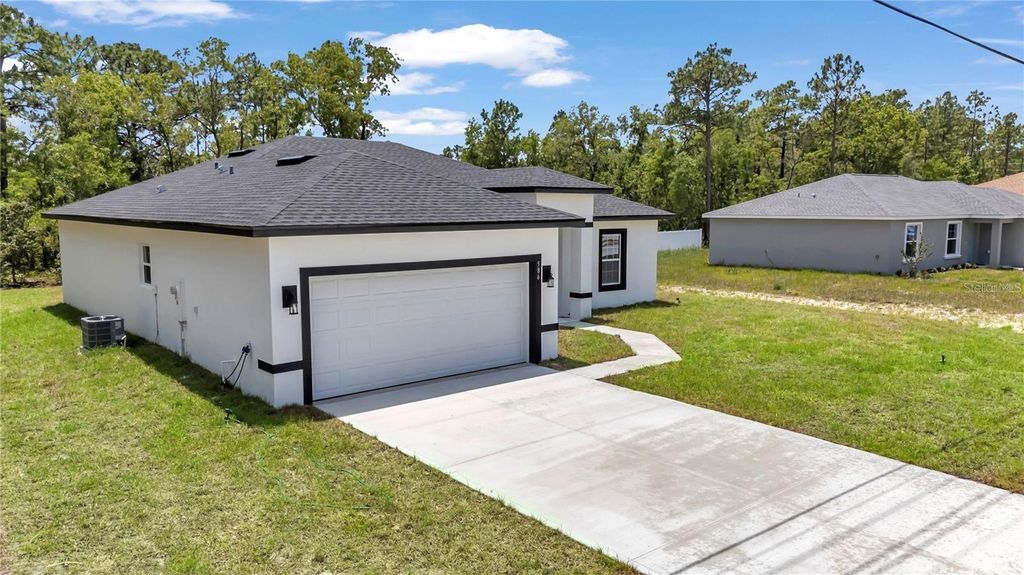 Photo of 586 Marion Oaks Trl, Ocala, FL 34473 (MLS # O6367897)