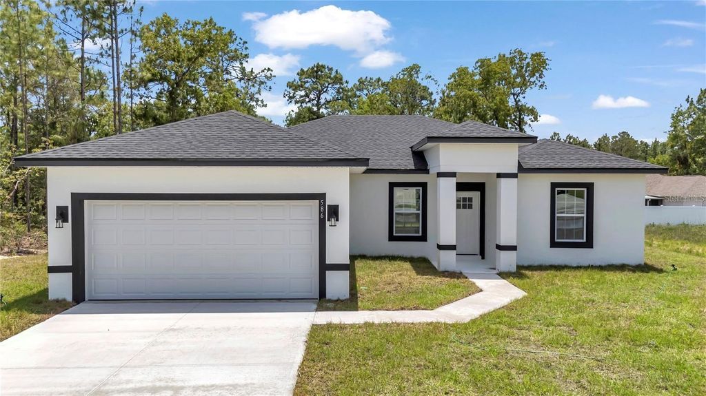 Photo of 586 Marion Oaks Trl, Ocala, FL 34473 (MLS # O6367897)