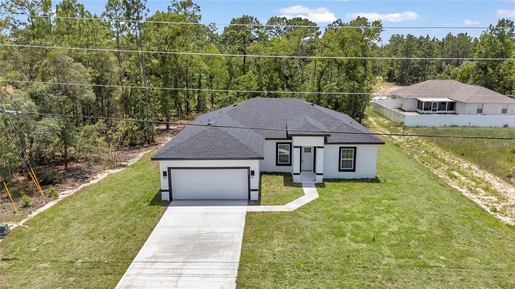 Photo of 586 Marion Oaks Trl, Ocala, FL 34473 (MLS # O6367897)