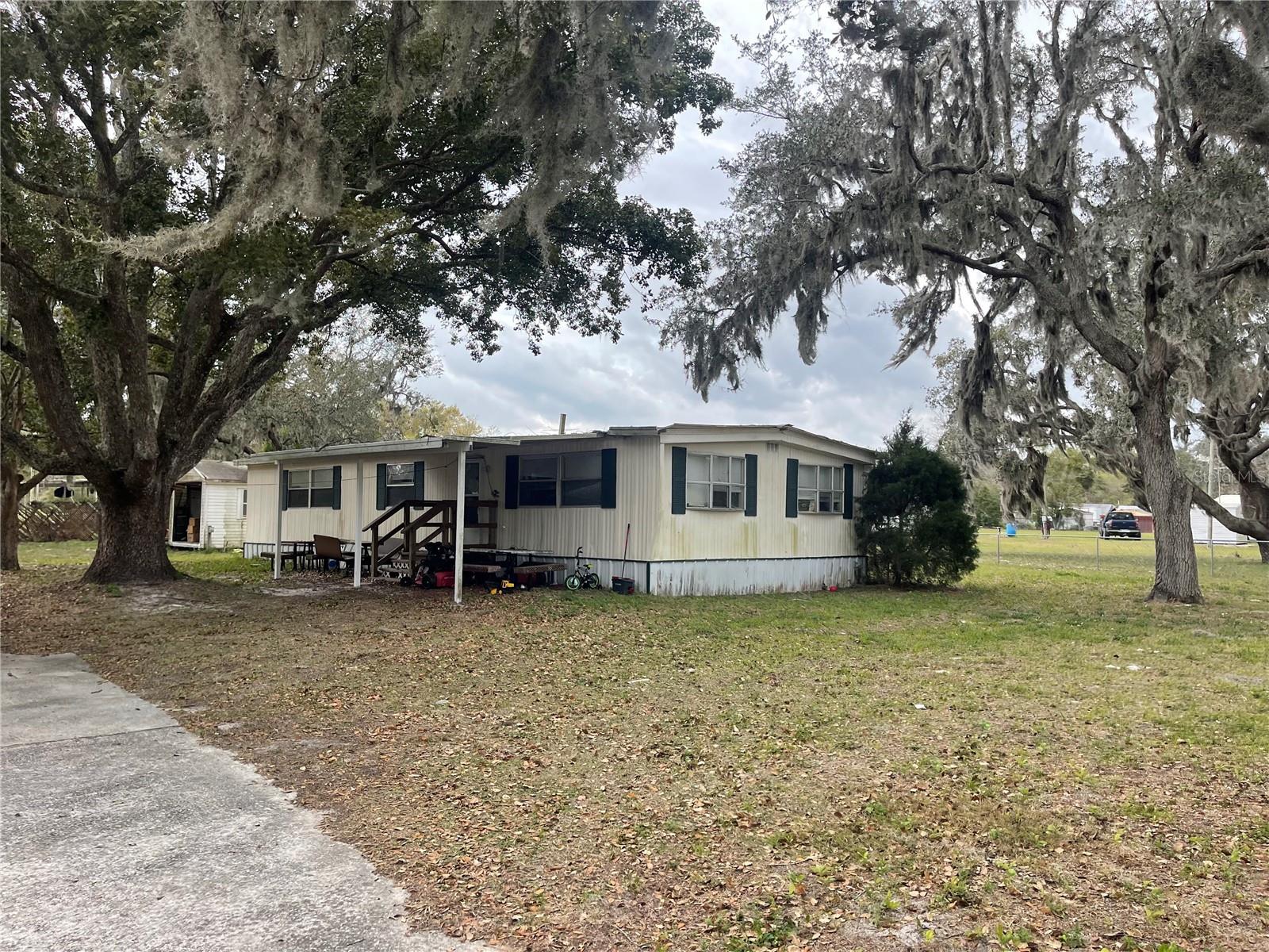 FL living at an affordable price or great investment property! This 3BD/2BA home is situated on 0.73 acres. Short distance to all shopping, schools, medical facilities, and restaurants. Make this your new winter retreat or year around home. Call today, don't miss this great investment opportunity.