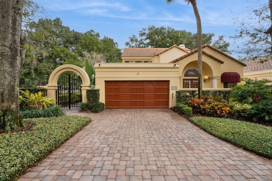 Old World Mediterranean Villa with Florida charm and beautiful Spanish architecture located in the center of Sweetwater Country Club. This much sought after gated community is comprised of only 30 Villas and has all the amenities of Sweetwater Oaks. Surrounded by the 16th green and fairway of Sweetwater golf course, this is the largest lot in the community. The open floor plan has soaring vaulted ceilings, gorgeous leaded glass entry doors, crown molding, walk in closets, hardwood floors, lush landscaping, wood burning fireplace and a wet bar with wine refrigeration. All the main living areas are located on the first floor with 2 additional large bedroom/bathroom suites on the second floor ideal for guests or lifestyle specific flex-space. The 4th bedroom is located downstairs and is currently be used as an office/den and has custom built-in cabinets. The foyer's impressive leaded glass doors open to the formal living and dining room. The kitchen is nicely appointed with stainless steel appliances, granite counter tops, and a center island with seating area and open to the family room and dining room.  The family room has a woodburning fireplace and wet bar with built in cabinetry. The primary bedroom/bath suite is downstairs and the bathroom has dual sinks, a 10' by 7" walk in closet, huge shower with separate shower heads, claw foot soaking tub and bidet.  The tile roof was replaced in 2012, home has been replumbed, remodeled kitchen and master bath, epoxy finished flooring in the garage, freshly painted inside and out, plantation shutters, and dual A/C's. Great home for entertaining with a relaxing outside living area surrounded by fresh lush landscaping, patio spa and the golf course frontage. This Villa is an end unit with an additional parking pad. Community features of Sweetwater include: a community center, tennis/pickleball courts, parks and playgrounds, basketball courts and skiable Lake Brantley access. Call for your private showing today!