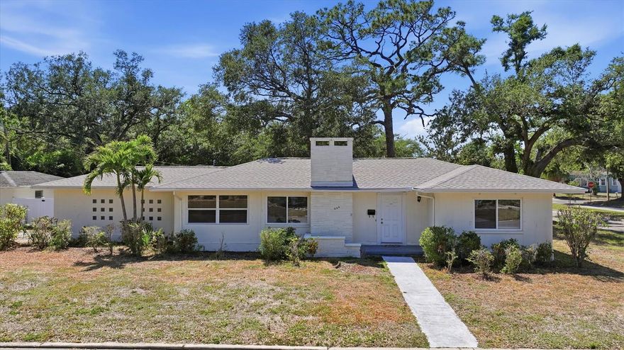 One or more photo(s) has been virtually staged. This charming West Bradenton block home offers 2 bedrooms, 2 bathrooms, and 1,583 square feet of comfortable living space. The updated kitchen blends modern convenience with classic appeal, while the formal living room features a cozy woodburning fireplace. A versatile bonus room provides extra space for an office, playroom, or guest area, and the expansive utility room could easily double as a workshop. Outside, enjoy a private fenced backyard on a generous quarter-acre lot, along with a detached one-car garage and a brand new roof! Ideally located just 3 miles from the beach and 8 miles from Holmes Beach, this home combines tranquility with easy access to coastal living.