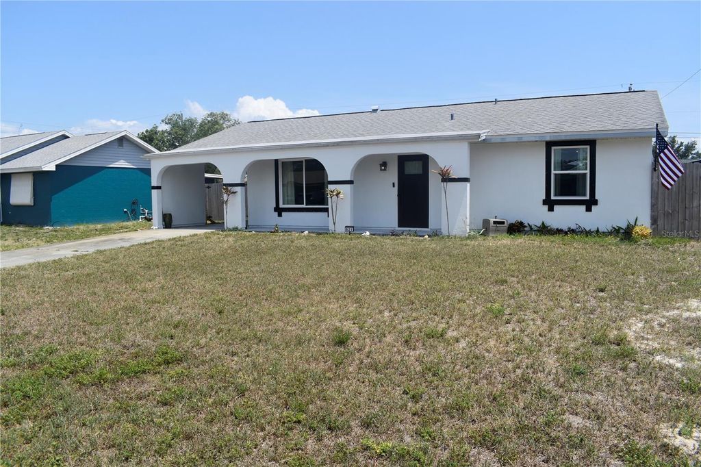Photo of 821 Silver Springs Terrace NW, Port Charlotte, FL 33948 (MLS # O6308366)