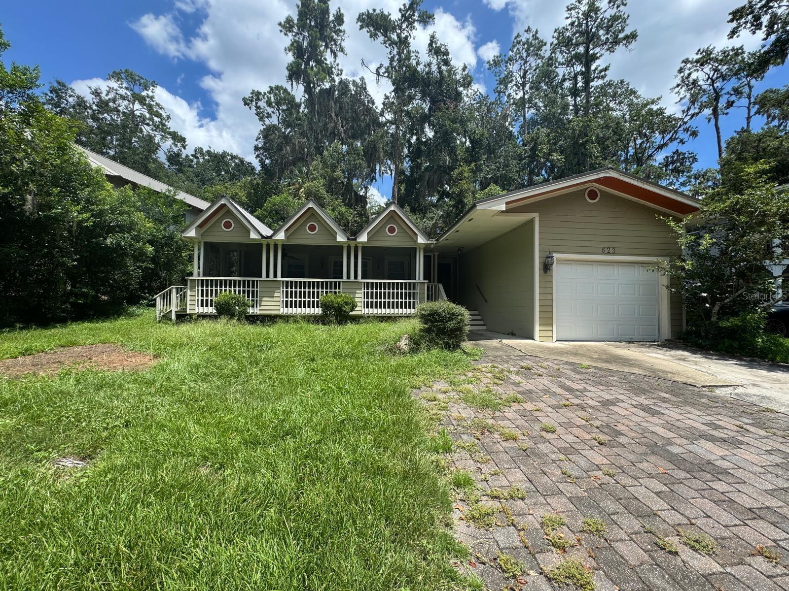 Welcome to your dream home in sought-after Golfview Estates—just steps from UF! This beautifully maintained 3-bedroom, 2-bathroom property features a 2018 metal roof, hardwood floors, and a high-efficiency HVAC system with a tankless water heater for modern comfort. Enjoy Florida living with a large screened front porch overlooking the serene buffer woods of the UF Golf Course and a fenced backyard with paver patio, for entertaining. The garage includes an extra fridge, and the oversized laundry room has ample storage.
Location is unbeatable: just a short walk to UF Levin College of Law, Ben Hill Griffin Stadium (The Swamp), Lake Alice, the UF Bat House, and popular shopping and dining. Have this one as a personal residence or long-term rentals, faculty, or Gator fans.
This one won’t last!