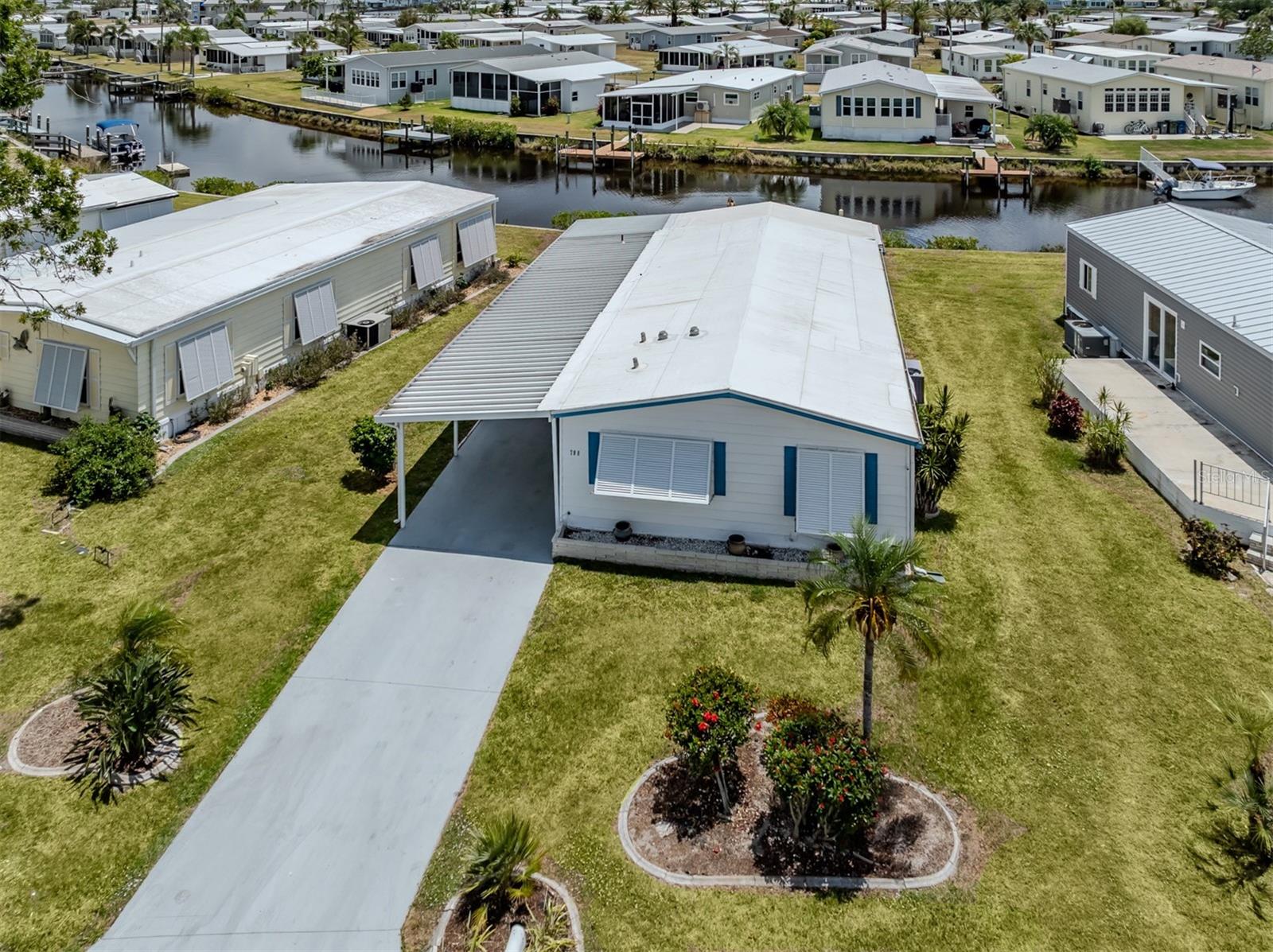 Welcome to waterfront living in the beautiful boating community of Harbor Cove. This charming 2 bedroom, 2 bathroom manufactured home is nestled in the desirable pet section and sits directly on a peaceful canal, complete with your very own private dock. Enjoy tranquil water views from the spacious Florida room, enclosed with glass windows that let in plenty of natural light.
Inside, the home features many updates including luxury vinyl flooring throughout, with the exception of the guest bedroom. Both bathrooms have been updated with lovely new vanities, and the master bathroom also offers a new shower insert and toilet. The master bedroom includes a generous walk-in closet, providing plenty of storage space. The guest bedroom offers a built-in Murphy Bed.
The home also boasts a brand new carport and new windows throughout. A double shed offers additional storage, and the covered back patio provides the perfect space to relax and enjoy the waterfront breeze.
Harbor Cove is a vibrant 55+ community located on the shores of the Myakka River, known for its boating access to the Gulf of Mexico. Residents enjoy a wide variety of amenities, including a marina, boat ramp, fishing pier, clubhouse, fitness center, and a full calendar of social activities. Whether you're an avid boater or simply enjoy peaceful waterfront views, this home is a wonderful opportunity to experience the Florida lifestyle.