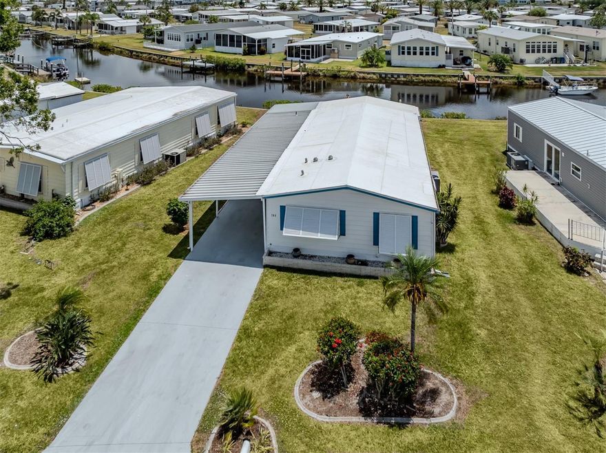 Welcome to waterfront living in the beautiful boating community of Harbor Cove. This charming 2 bedroom, 2 bathroom manufactured home is nestled in the desirable pet section and sits directly on a peaceful canal, complete with your very own private dock. Enjoy tranquil water views from the spacious Florida room, enclosed with glass windows that let in plenty of natural light.

Inside, the home features many updates including luxury vinyl flooring throughout, with the exception of the guest bedroom. Both bathrooms have been updated with lovely new vanities, and the master bathroom also offers a new shower insert and toilet. The master bedroom includes a generous walk-in closet, providing plenty of storage space.  The guest bedroom offers a built-in Murphy Bed.

The home also boasts a brand new carport and new windows throughout. A double shed offers additional storage, and the covered back patio provides the perfect space to relax and enjoy the waterfront breeze.

Harbor Cove is a vibrant 55+ community located on the shores of the Myakka River, known for its boating access to the Gulf of Mexico. Residents enjoy a wide variety of amenities, including a marina, boat ramp, fishing pier, clubhouse, fitness center, and a full calendar of social activities. Whether you're an avid boater or simply enjoy peaceful waterfront views, this home is a wonderful opportunity to experience the Florida lifestyle.