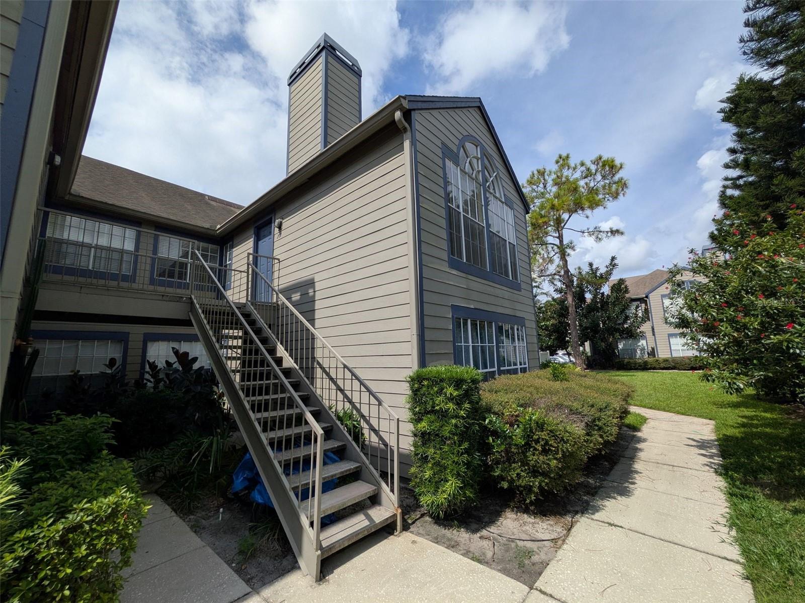 INVESTOR'S DREAM!! Welcome to Hidden Village in the heart of Lake Mary! This spacious second floor 3-bedroom, 2-bath with balcony is ready for someone to come in and make it their own or as investor's special. Incredible potential with this unit. Some key features are vaulted ceilings, lots of natural light, fireplace in living area, inside utility, 2 spacious bedrooms- on being primary with en-suite bath) The third bedroom with sliding glass door to balcony makes a perfect guest room, flex space, home office, craft room....Galley kitchen with solid countertops. Unit needs TLC--flooring, paint, blinds, bathroom & kitchen updating.... Conveniently located just minutes from I-4 and Lake Mary Blvd, with top-rated Lake Mary schools, all amenities, restaurants, entertainment, shopping and parks. Community amenities include pool, clubhouse, and tennis courts. OPPORTUNITY awaits the right buyer. Property being sold AS IS.
