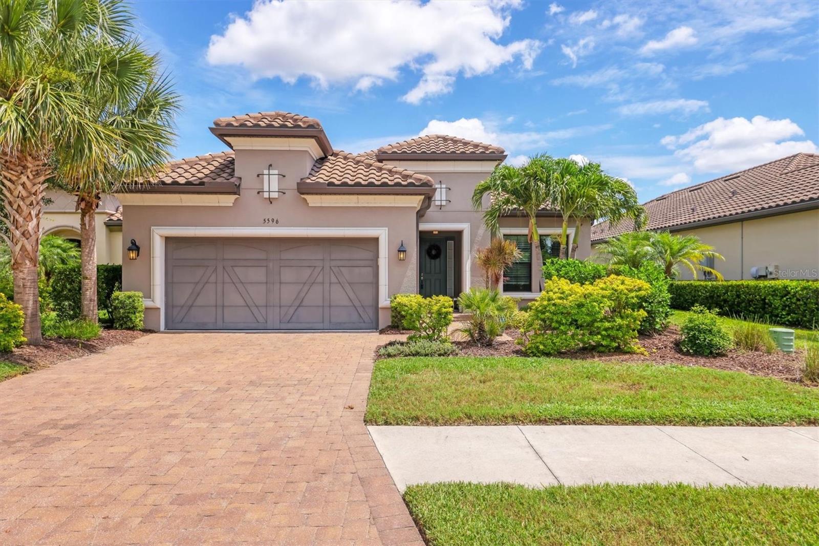 This private pool home checks every box with stylish upgrades, the ultra popular "Lazio" floor plan, and a backyard built for relaxing or entertaining year-round! With 3 bedrooms, 3 bathrooms, and a versatile den, the home welcomes you with a bright foyer and crown molding that continues through the den and main living area. The den offers flexible space for a home office, playroom, or hobby room. The living room features a tray ceiling and sliding doors that open to the lanai, while the open dining area flows seamlessly into both the living space and kitchen. The kitchen offers an oversized island with quartz counters, stainless steel appliances, a pantry closet, and its own set of sliders leading out back. The primary suite is tucked into the back corner of the home and features a tray ceiling, space for a seating area or reading nook, an en suite bathroom with dual vanities, and an oversized walk-in closet. Two additional bedrooms are located near the front—one with its own en suite bathroom, and the other just steps from a full guest bath. The exterior oasis offers an expansive covered lanai providing room for both lounging, sunbathing, entertaining, and dining, while the screened enclosure surrounds a sparkling in-ground pool with a waterfall feature—a true private retreat. Your storage and hobby space needs are well handled with the 3 car tandem garage. Bellacina by Casey Key is a gated, maintenance-free community offering resort-style amenities including a heated pool with cabanas, clubhouse, fitness center, tennis and pickleball courts, bocce, dog parks, walking trails, and a full-time Activities Director. All just a quick golf cart ride to Nokomis Beach and a short drive to Venice, Siesta Key, and downtown Sarasota. Purchase with confidence, the seller is including a 1 year homebuyer warranty policy for your peace of mind!