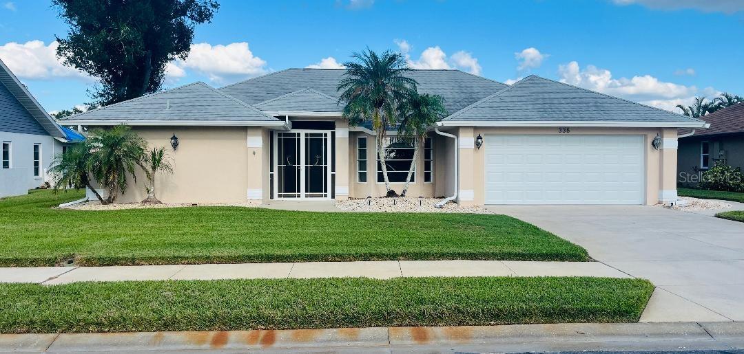 Brand New Roof installed in January 2025! Welcome to this charming 3-bedroom, 2-bathroom home in the highly desirable Lake of the Woods community, where you can enjoy the best of Venice living without CDD fees and a low HOA. The large master bedroom is thoughtfully located on one side of the house for added privacy and features two walk-in closets and an en-suite bathroom. Fresh interior paint gives the home a bright, clean look and is complemented by new luxury vinyl flooring in the main living area (installed November 2024), modern light fixtures, and abundant windows that fill the space with natural light. The kitchen offers everything you need, including granite countertops, a glass tile backsplash, and stainless-steel appliances - functional and ready for your personal touch. Two additional bedrooms, each with walk-in closets, provide ample storage and comfort for family, guests, or home office. No more trips to the garage, enjoy the convenience of an indoor laundry room. Newly installed garage door December 2024 enhances curb appeal. Lake of the Woods offers beautiful sidewalks and walking trails, ideal for leisurely strolls or active outdoor living. This family-oriented neighborhood is just minutes from the vibrant Wellen Park, featuring activities for all ages, as well as downtown Venice, where you can explore shopping, dining, entertainment, and some of the most beautiful beaches in the world. Don't Miss Out! This home is a true gem in a fantastic location. Schedule your private showing today!