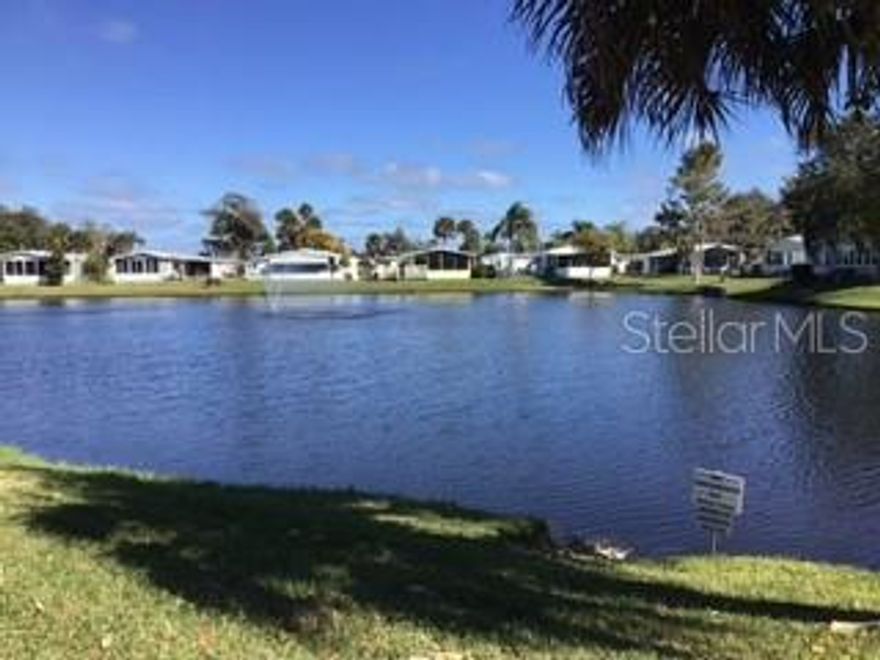 LAKEFRONT lovely, lovely large 3 bedroom.  Home also has a den and bonus room.  2nd bedroom has a built in office.  The bonus room is the owner's retreat right next to the master and has an entrance to the large Florida room facing the lake.  Kitchen and master bath has been remodeled.  Kitchen pantry has pull out drawers.  Master bath has walk-in shower with a fold up bench.  Guest bathroom has a tub and shower.  Home has a water treatment system for the whole house.  Shed has the washer and dryer with cabinets above.  This home has three exterior doors.  6 panel interior doors.  17 windows replaced 2012, roof 2014, A/C 2018, replaced vinyl windows in Florida room 2018, and replaced 1 window 2021. This is a must see!  HOA fees are quarterly and include high speed internet and platinum (lots of channels cable TV).  A few of the many amenities are: heated pool,  boat ramp to the intracoastal, screened hot tub, tennis, shuffleboard, bocce and many activities. ;Water: City