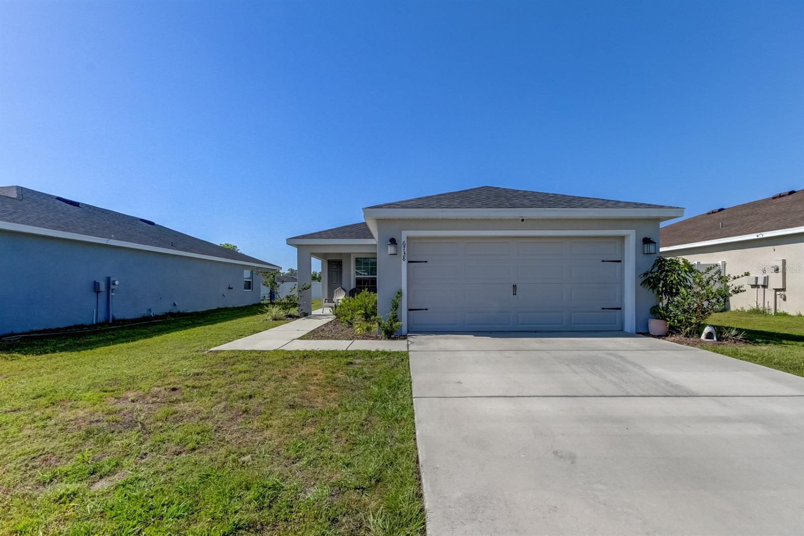 Welcome to this beautifully maintained 3-bedroom, 2-bath home located in the desirable Chapel Creek community of Zephyrhills. Built in 2021, this move-in-ready residence offers 1,486 square feet of heated living space and sits on a well-sized 0.13-acre lot. The open-concept floor plan features a spacious great room, modern kitchen with ample cabinet space, and a split-bedroom layout for added privacy. The primary suite includes a walk-in closet and en-suite bath with dual sinks and a walk-in shower. Enjoy Florida living with a patio and a backyard ready for your personal touch. Chapel Creek offers community amenities including a pool, playground, and walking trails, with low HOA fees and no CDD. Conveniently located near schools, shopping, dining, and easy access to major highways. Don't miss your opportunity to own this gem. Schedule your private tour today!