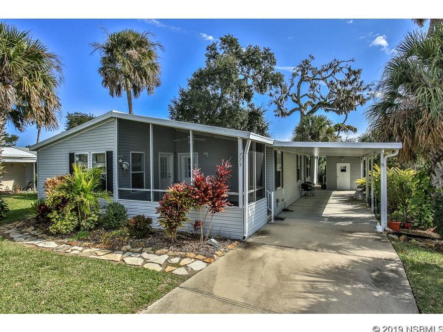 CUSTOM BUILT 2002 PALM HARBOR. Steps from the private resident boat launch which is on the intracoastal.  Observation deck is by the boat ramp.  Watch Space Center Rocket launches from the deck.  Home has that "wow" factor.  Kitchen completely remodeled with new cabinets, new counter top and indirect lighting (change colors by the remote).  Hugh pantry.  French doors lead off living room into the office and master bedroom.  Opposite end of kitchen is 2 more bedrooms and a full bath and large laundry room with a sink and storage.  One guest bedroom has its own door going out to the front screen porch.  An extra attraction is the bonus room which has great potential as a hobby, craft, art studiio, TV or rec room.  Drywall throughout with rounded corners, extra insulation, double pane UV windows.  Laminate and 19" ceramic tile.  Outside 10x10 utility room with electric .  Four outside waterproof electric outlets including one large amp RV outlet.  Covered carport wirh extra long driveway. Deep well.  Roof and A/C 2017.  Call today to see this beautiful home.  Low association dues includes cable and outside storage for either a boat or RV (one toy) when available.  Edgewater Landing has loads of activities.  Resort living every day! ;Water: City
