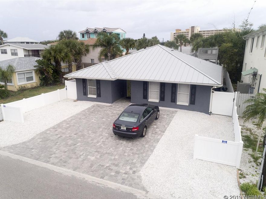Perfectly located just 3 homes to the beach park and one street north of Flagler Avenue. Walk to breakfast, stroll the shops on Flagler Ave, pack a picnic lunch for the beach, return home to take a nap on your back porch deck, prepare to walk to dinner, followed up with live entertainment, then a short stroll home to end another perfect day. This block home was completely remodeled inside and out with top-of-the-line finishes, recessed lighting, AC with UV lights, new kitchen and baths, paver driveway and a metal roof. Itâs designed to be low-maintenance with crushed shell and mulch ground cover so you can enjoy your days off. Storm coming? Prepare quickly with roll-down shutters hidden in the soffits. This modern home boasts 4 bedrooms and 3 full baths. Choose from 2 master suites, one with a huge walk-in closet and another with egress to the outside (in-law suite?). Enjoy tile flooring throughout, a stunning kitchen with white shaker wood cabinets, stone tops, beveled subway tile backsplash and stainless appliances.  Thereâs a huge utility room off the kitchen for pantry or additional storage. 2 more guest bedrooms share a hallway bathroom. The family room adjoins the kitchen and breakfast nook and looks out over the fenced backyard.  Thereâs a 2nd story wood deck to catch the ocean breezes or warm up to some sun rays.  This amazing home offers additional peace of mind with 5 years remaining on the transferable Select Home Warranty. If you deserve the very best, then this home was meant for you. ALL INFORMATION IS ASSUMED ACCURATE BUT NOT GUARANTEED. MEASUREMENTS ARE APPROXIMATE.  BUYERS AND THEIR AGENTS TO VERIFY ALL INFORMATION DEEMED IMPORTANT TO THEM. ;Water: City