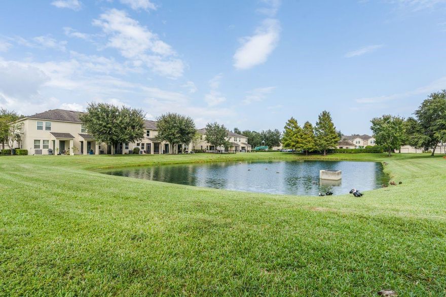 The townhome that you have been waiting for! Enjoy your morning cup of coffee watching the ducks swimming in the pond. Beautifully updated 3 bedroom/2.5 bath waterfront townhome with tons of natural light. Updated kitchen with stainless appliances and breakfast bar overlooking the family room. Upstairs you will find 3 spacious Bedrooms, including the Master Bedroom complete with Walk-In Closet and access to the Master Bathroom which features Granite Countertops and a large walk-in shower with dual showerheads. Washer & Dryer are easily accessible upstairs as well, so you won’t have to go up & down the stairs when it’s time to do laundry! Beautiful screened porch with no rear neighbors! New roof 2023! 1 car garage. Amazing location with easy access to UCF Research center, shopping, restaurants and highways! The community offers a playground, swimming pool, and carefree living that includes all exterior maintenance!