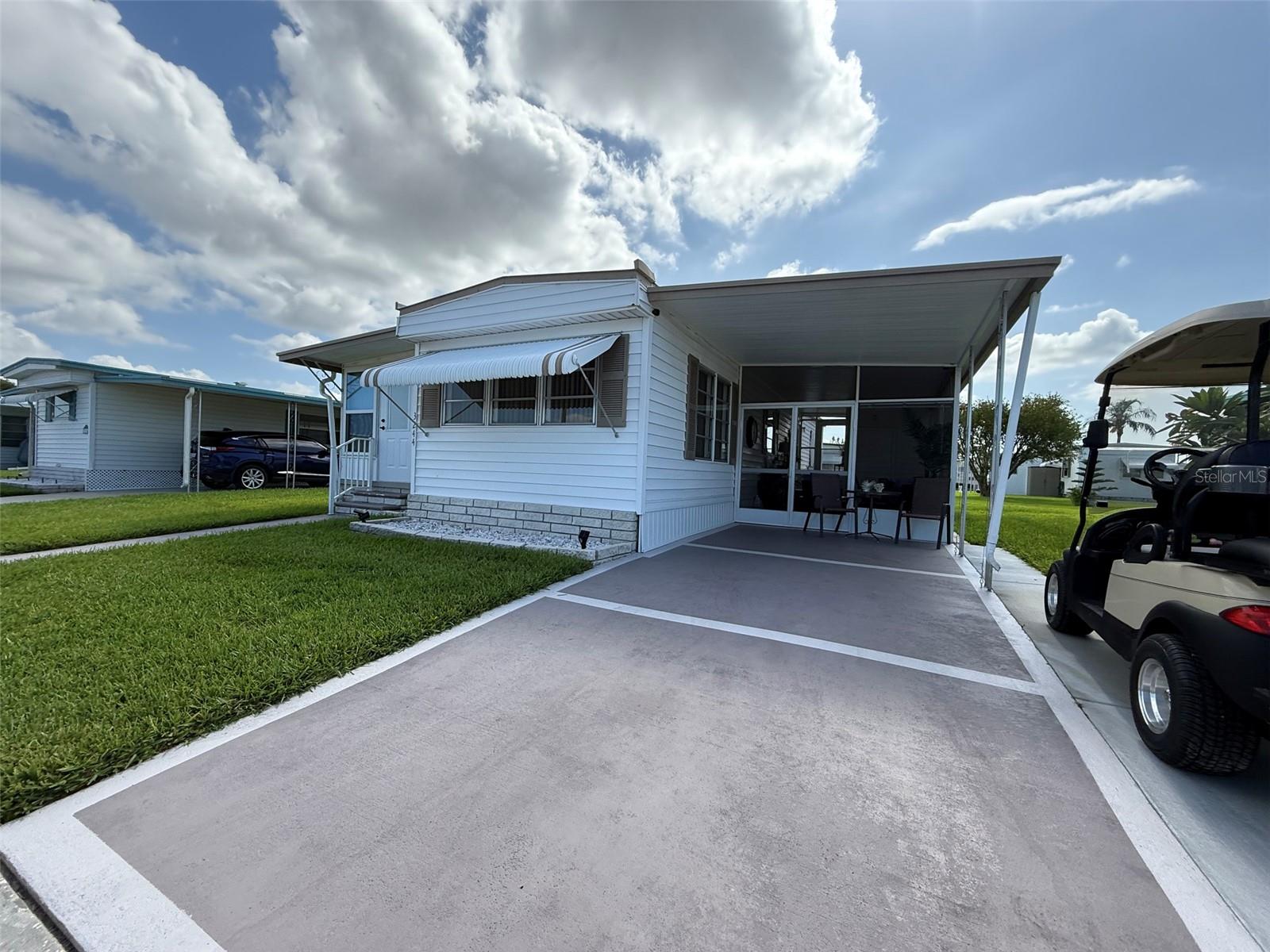 Retire in comfort and enjoy the tranquil Florida lifestyle in this beautifully furnished 1-bedroom, 1-bath home, nestled in a welcoming 55+ community where you own the land—no lot rent!
This charming residence features a bonus Florida room that offers flexible space—perfect for an office, relaxing lounge, or easily converted into a second bedroom for visiting guests. The home boasts great curb appeal, a large covered patio ideal for enjoying Florida's sunshine, and a private driveway with room for a golf cart.
The active community offers a range of amenities designed for relaxed, social living, including a heated pool, clubhouse with planned activities, lawn care, and trash service—all included in the low HOA fee. This home is located walking distance from the community pool!!!
Whether you're a seasonal snowbird or looking to settle into retirement full time, this move-in-ready home offers affordable, low-maintenance living in a peaceful setting. Sold As Is. Measurements are approx. All information is deemed to be accurate and for the buyer to verify.