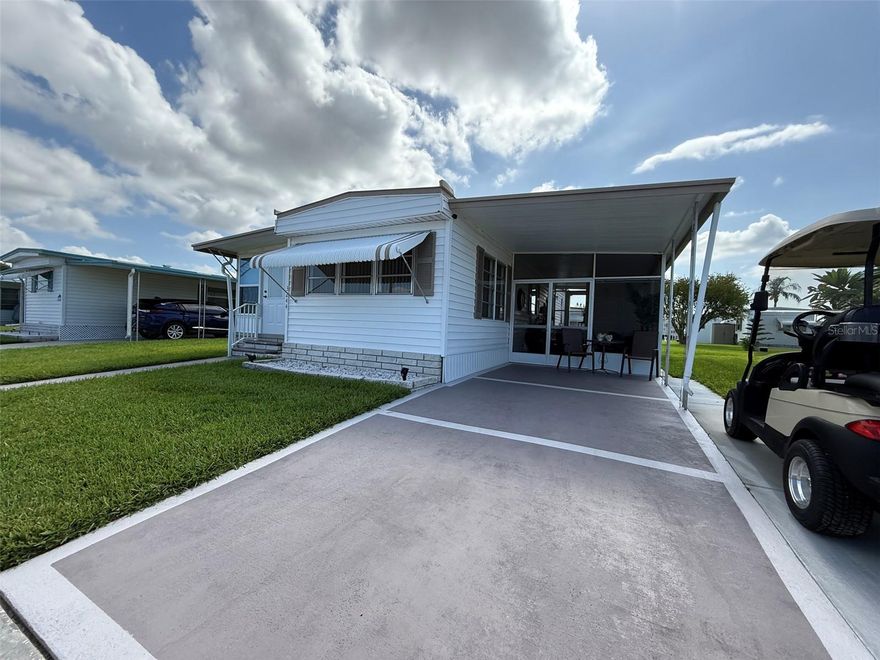 Retire in comfort and enjoy the tranquil Florida lifestyle in this beautifully furnished 1-bedroom, 1-bath home, nestled in a welcoming 55+ community where you own the land—no lot rent!

This charming residence features a bonus Florida room that offers flexible space—perfect for an office, relaxing lounge, or easily converted into a second bedroom for visiting guests. The home boasts great curb appeal, a large covered patio ideal for enjoying Florida's sunshine, and a private driveway with room for a golf cart.

The active community offers a range of amenities designed for relaxed, social living, including a heated pool, clubhouse with planned activities, lawn care, and trash service—all included in the low HOA fee. This home is located walking distance from the community pool!!!

Whether you're a seasonal snowbird or looking to settle into retirement full time, this move-in-ready home offers affordable, low-maintenance living in a peaceful setting. Sold As Is. Golf cart included! Measurements are approx. All information is deemed to be accurate and for the buyer to verify.