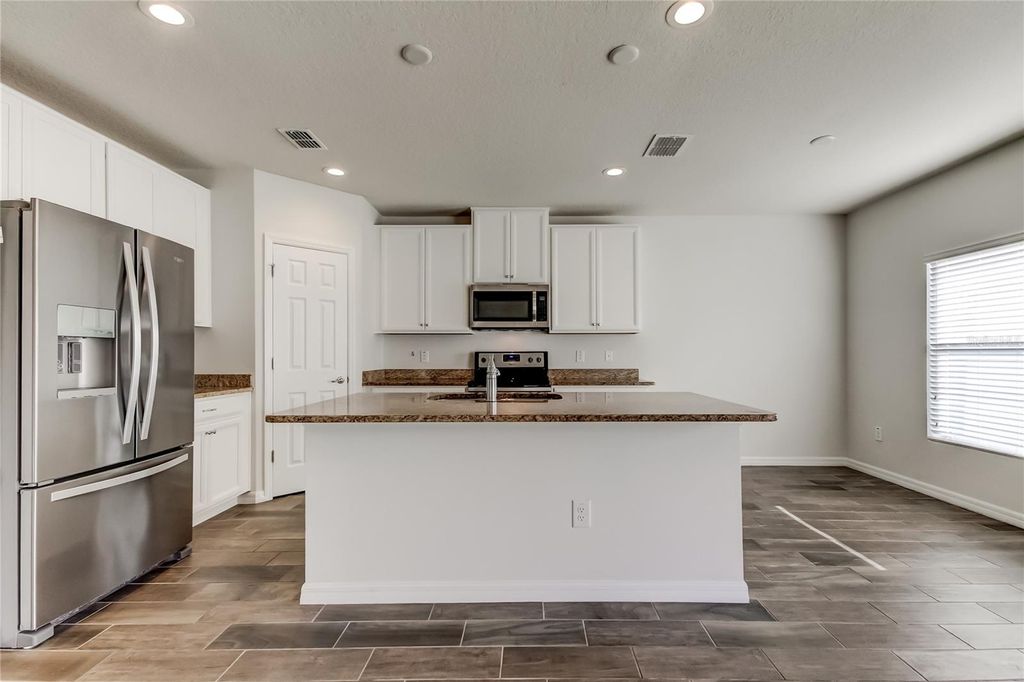 Photo of 5050 Suncatcher Drive, Wesley Chapel, FL 33545 (MLS # TB8462958)