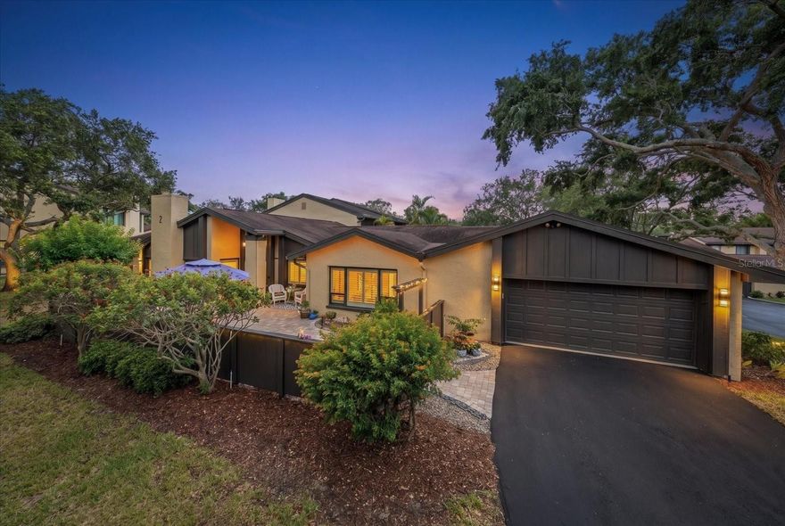 Impressive from the moment one enters the private brick paved courtyard that is surrounded by seasonal flowers and comfortable seating  this maintenance free one-story villa is in a premier waterfront community, minutes to beaches, fine dining and access roads to Tampa, St Pete and Clearwater. Rest easy in its high and dry, non-evacuation location while enjoying all the attributes coastal living offers. Clearly designed for the entertainer, recent renovations reveal an outstandingly open floor plan with its purposeful design that strikes a balance for hosting gatherings in the main living areas or retreating to the secluded bedroom suites. Vaulted ceilings reflect a light airiness that exemplifies a comfortable feeling and refined lifestyle. Chef's dream kitchen is fully equipped with stainless  appliances, impressive breakfast bar, separate pantry and a dedicated breakfast area with views over the sunlit courtyard. Porcelain wood grain tile covers all flooring, newer impact windows, HVAC system, plumbing and electrical- everything has been updated and all of the work is done! The living area is anchored by a classic fireplace creating a warm inviting atmosphere and transitions easily to the casual family room. Appreciate retiring to the very private primary bedroom that adjoins a dedicated office, and has an ensuite bathroom with walk in shower, separate tub and dual closets.  Oversized two car garage, extensive storage, and lots of privacy make this a rare find! The luxury of liberty defines this exceptional property mirroring a single-family home without the upkeep of landscaping, lawn, or pool.  HOA fees include maintenance of 25 acres of lushly landscaped grounds, water, sewer, trash, roof, exterior maintenance, internet and cable. Spend the weekend at the beach, on the pickleball court, or boating- it’s the lifestyle you have earned!