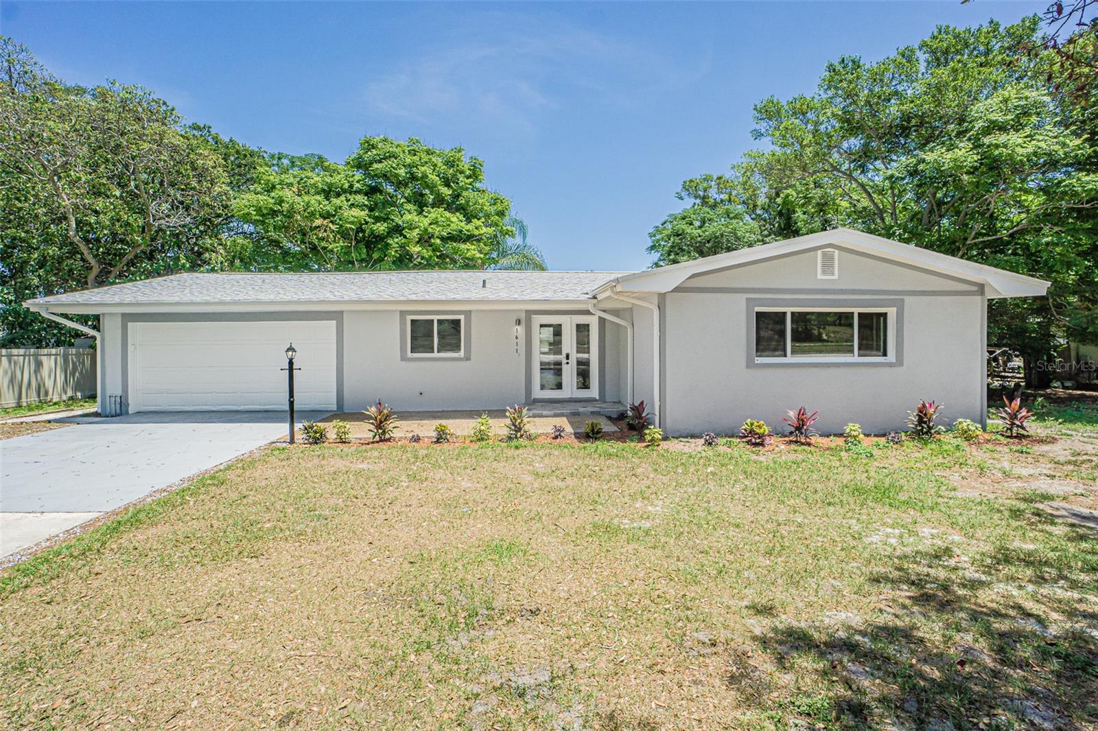 Under contract-accepting backup offers. Welcome to your beautiful Clearwater home featuring 4 bedrooms, and 3 bathrooms and perfect location, in the desirable Keeneair neighborhood just across of Eagle Lake Park a 163-acre preserve with miles of hiking and walking trails, you can not find a better location, This home offers an awesome floor-plan and all that home buyers are looking for, the main bedroom features a gorgeous master bathroom with a walk-in shower, a spa tub, two walk-in closets, All the important improvements have been made New Roof replaced in 2022, Brand new HVAC system, New Impact Windows, New Stainless Steel Appliances, New Kitchen Cabinets, Brand New Luxury Vinyl Flooring, New Recessed Lighting thoughout the house, a Huge 2 car garage in addition to spacious driveway (along with space on either side of the home) allows room for boat or extra car storage. There are no deed restrictions, just off convenient arteries that will take you easily to Clearwater Beach (15 min), Tampa (30 min), St Petersburg (30 min), as well as the other charming towns Pinellas County has to offer. don't miss it