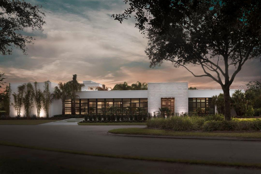 The 2017 New American Home is perfectly situated along the back nine of Lake Nona Golf & Country Club’s world-renowned championship golf course, cutting-edge sustainability, and stunning contemporary design are the hallmarks of this Phil Kean Design Group home. Enjoying multiple golf and water views, the home displays a superb use of glass, openness, and seamless transitions from indoor to outdoor living with covered porticos and lanais. The home features over 8,245 square feet of living space, plus a 1,775 square foot rooftop terrace which is positioned to maximize the incredible views. Focused on the main level, the home’s open floor plan includes five bedrooms, six full and four half bathrooms, and flows from an open-air, interior courtyard entry with a media room, into the grand foyer that shares a glass fireplace with the great room, which is surrounded by automated, fully-pocketed sliding doors, and is anchored by a floor-to-ceiling glass-enclosed wine bar. The sleek kitchen is highlighted by state-of-the-art Wolf and Sub-Zero appliances surrounded by Ceasarstone counters and high gloss cabinetry. Complete with an expansive walk-in closet and magnificent bath, the owner’s suite boasts unique luxuries, including a morning bar with a Wolf coffee system, a safe room, and one of three laundry stations. Just outside the owner’s suite sits a private lanai with a fireplace and access to the health and wellness space, which features a steam room, private powder bath, and space for massage or exercise. The ample outside living area is centered on an infinity-edge pool, which features an expansive sun shelf and floating spa, all meticulously integrated into the international architectural style. Additional details include: LEED Gold Platinum certification/pod style architecture, Solar to 18KW, Tesla backup batteries and whole house generator, Outdoor Phantom screens/indoor Lutron blinds, Full guest casita with private lanai, Imported glass Belgian stairway, Gallery, Theater room, Elevator and Two, 2-car garages.
Note: The adjacent, vacant .78-acre home site can be purchased with the home.