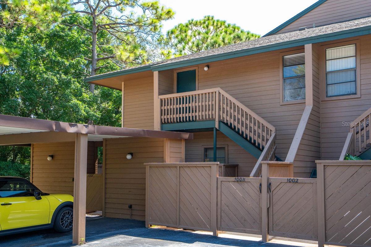 One or more photo(s) has been virtually staged. Nice! Nice! Nice! If you're looking for move-in ready, maintenance free living, look no more! This 2BR/2BA Gleneagles gem sits in a NON flood zone and offers soaring ceilings in a cabin-like setting. Community is just off the beaten path, yet near everything. It features a bright, open split bedroom plan with a relaxing screened porch. Upon arriving, you're greeted by a tropically landscaped property with tall majestic trees, ample guest parking, and a covered parking spot. Open your front gate and discover a private courtyard with storage closet. Walk up the stairs to a landing with main door access. Enter into a welcoming foyer with dramatic views of the vaulted ceilings and great room. Natural light from the large windows and porch sliders adorn the main living space. An efficient updated kitchen with breakfast bar flanks the great room. Adjacent to the kitchen sits a utility room / closet pantry with full size washer & dryer. The master bedroom includes an updated en-suite bath, walk-in closet and sliders to the porch. Opposite the master is a nice sized guest/2nd bedroom along with an updated hall bath. Finally, enjoy your morning coffee and evening glass of wine from the serenity of the screened porch with tranquil views of shaded trees & mature landscaping! Updates include, KITCHEN: shaker cabinets with hardware, granite counters, decorative backsplash, sink, faucet, and stainless steel appliances, MASTER & HALL BATHS: vanities, hardware, faucets, granite counters, mirrors, toilets, showerheads, custom tiled tub, AND custom tiled walk-in shower with glass doors, UTILITY ROOM: LG washer & dryer, INTERIOR: newly textured walls & ceilings (NO popcorn here), switches & outlets, baseboards & quarter round, 6-panel doors with hardware, crown molding, light fixtures, ceiling fans, fresh paint, PLUS efficient waterproof laminate flooring. Gleneagles I is a meticulously maintained, pet friendly, community with gorgeous clubhouse, screened lanai, heated pool, paved sunning deck, tennis, and pickleball. It is ideally located near beaches, restaurants, shopping hubs, and next to the championship golf courses at Innisbrook. A short drive away are the famous Sponge Docks of Tarpon Springs, Howard Park, Old Palm Harbor, Eclectic Ozona, the Dunedin Causeway, Honeymoon Island and Historic Downtown Dunedin. This is a MUST SEE for buyers seeking a move-in ready condo with maintenance free living and prime location.