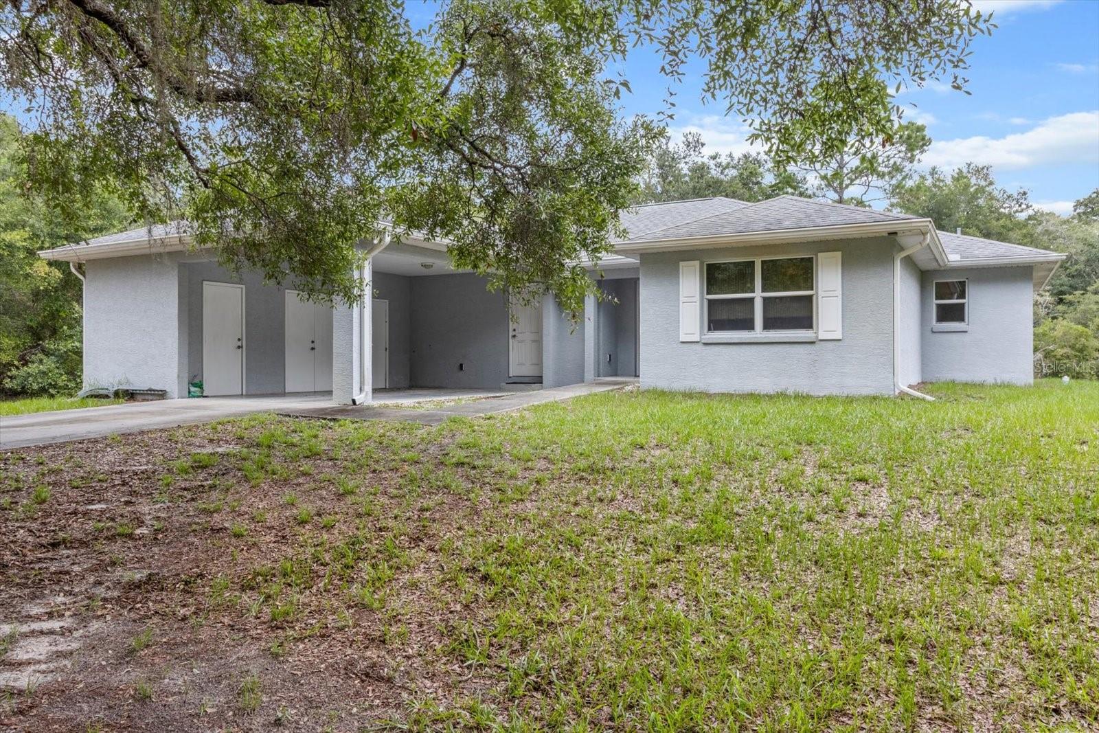Welcome to your slice of peaceful paradise in Crystal River! Nestled on over an acre of land, this beautifully maintained concrete block home is like new—and it’s ready for you to move in and make it your own. Featuring 3 bedrooms and 2 bathrooms, this thoughtfully designed home offers comfort, functionality, and versatility. One of the bedrooms is currently used as an office, great for remote work or creative pursuits. The layout is also handicap accessible, with wide doorways, a master shower with wheelchair access, and an easy-access front entry—ensuring convenience for everyone. Step inside to enjoy low-maintenance laminate vinyl plank flooring throughout—no carpet here! Relax and unwind in the spacious 12’ x 18’ sunroom, awesome for enjoying Florida’s year-round sunshine. Need more storage or workshop space? There’s a 10’ x 12’ shed, plus a carport with a lockable storage area. Worried about storms? This home comes equipped with a whole-house generator connected to a 250-gallon buried propane tank, offering peace of mind and continuous comfort during any weather. This property offers the perfect blend of modern convenience, accessibility, and space to breathe, all while being just a short drive from Crystal River’s shops, dining, and world-famous springs.
