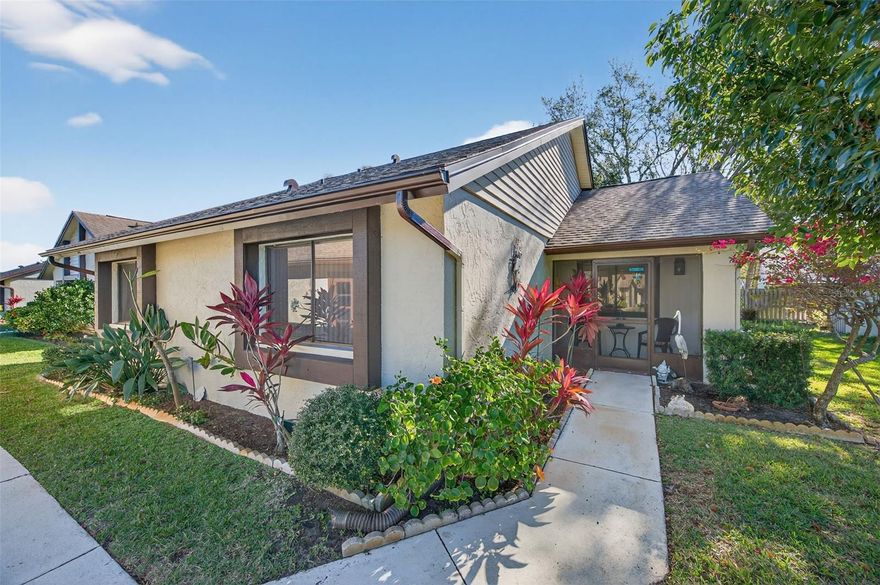 Welcome home to the highly desired community of Village on the Green. Purchase with peace of mind! This property has an elevation of over 70'. It is in Flood Zone X and a Non Evacuation Zone. This is a single family home with 2 bedrooms, 2 full bathrooms, a climate controlled Florida Room, and a 1 car garage. The roof was replace in December of 2025 and the electric panel has been upgraded. The open living, dining room leads directly to the Florida room and is great for entertaining.  The eat in kitchen also overlooks the Florida room and has a view of the screened front porch. The primary suite is very large, features a en-suite bathroom and a walk in closet. The guest bedroom can double as an office, craft room or whatever suits your needs. The HOA covers lawn cutting, watering and fertilizing, Fences, cable TV, internet along with the gorgeous recreation center. This community is a lifestyle, not just a location. Enjoy a sparkling pool, a clubhouse with a fitness center, library, card room and banquet room. Outside you will find the shuffleboard courts and community picnic area complete with gas grills for residents use. The clubhouse offers card playing and board game groups of all kinds as well as a shuffleboard group that meets weekly in the fall through the spring. Additionally there are regular community events throughout the year. And the best part, you're just minutes away from the heart of vibrant Downtown Dunedin, with its charming shops, delectable dining, and lively entertainment. Plus, you’re close to Honeymoon Island, Caladesi Island and more of Florida’s best beaches and fun activities. This home offers you peace of mind and fun in the sunshine. Don’t just dream of the Florida lifestyle – live it!