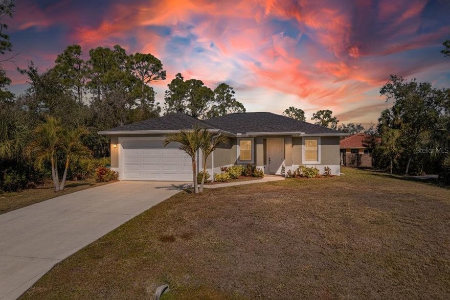 HIGH & DRY IN FLOOD ZONE X — BEAUTIFUL 2022-BUILT SALTWATER POOL HOME ON A PRIVATE DOUBLE LOT.

Morning coffee tastes different when you step through the impact sliders and onto your lanai, the aqua-blue saltwater pool shimmering in the early light. Palms sway beyond the screen enclosure. No tight back neighbors pressing in. Just trees, sky, and the quiet kind of privacy that feels intentional.

This 3 bedroom, 2 bath residence sits on a rare double lot — a meaningful distinction on this street where many homeowners have intentionally secured the lot beside them to preserve space and separation. It changes the entire feel of the property — expansive, protected, peaceful.

Built with solid concrete block construction and impact windows and sliders throughout, this home offers strength and peace of mind without the need for shutters or last-minute storm preparation.

Inside, the design is crisp and modern with warmth woven through it. Tray ceilings elevate the main living area. Recessed lighting keeps the lines clean. Wide plank flooring grounds the home in a soft coastal palette.

The kitchen is striking without being flashy — glossy white upper cabinetry balanced by warm wood lowers, granite countertops, stainless appliances, and a contemporary backsplash that adds texture and depth. The oversized island invites conversation, wine glasses, homework, and late-night laughter. It opens naturally into the living and dining areas while still feeling defined and intentional.

The primary suite offers a quiet retreat. Guest bedrooms are light-filled and welcoming — ideal for visitors, family, or a refined home office. Bathrooms carry through the same polished finishes with modern vanities and granite surfaces.

And then — the outdoor living.

The covered lanai is generous and shaded, perfect for entertaining as music drifts and conversations stretch long into the evening. The screened enclosure frames the pool beautifully, while the surrounding paver deck gives you space to lounge, gather, and truly live outside the way Florida living was meant to be.

The additional lot provides breathing room and flexibility — whether preserved as green space or simply enjoyed as the buffer that makes this home feel different from the rest.

This is not just a newer home.
It is intentional Florida living — done right.