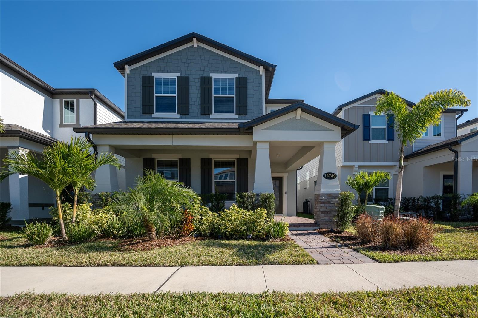 Very desirable area in Winter Garden, at Ovation This 4-bedroom, 3.5-bath, 2,781 square foot home with 2-car ally-load garage.. This versatile plan will wow you the minute you enter, with its impressive 2-story foyer. A bedroom with its own full bath is located up front in the first floor, creating the perfect spot for guest or in-laws. Amazing Kitchen with Quartz counter tops and 42" cabinets. The family room, kitchen, and dining room are all open to each other, creating a perfect spot for family hangouts or weekend entertaining, keeping everyone in the mix. Enjoy a Screen Patio Lanai located on the side of the home through the oversized sliding glass door. Head upstairs to find three more bedrooms and a loft. The loft is the perfect space for movie night, game day, or just a second hangout. It separates the owner’s suite in the back of the home from the secondary bedrooms, giving everyone the privacy, they deserve. The owner’s master suite features two very impressive sized walk-in closets and a bathroom to match. You’ll be happy this luxury vacation home near Disney is built with features that meet the Energy Star. Ready to move in