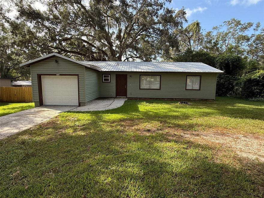 **OWNER FINANCING AVAILABLE WITH QUALIFIED DOWN PAYMENT** Charming 2/2/1 home in the heart of Brooksville just off the coble stone street, featuring a welcoming mix of updates and classic comfort. A durable metal roof provides peace of mind, while the spacious back deck offers a perfect spot to relax or entertain with views of the surrounding greenery. Inside, the kitchen has been thoughtfully updated with warm finishes and stainless appliances. Both bedrooms are generously sized including a primary suite with a very large walk-in closet and attached full bathroom. LVP flooring throughout (no carpet). Outside, the property offers plenty of room for gardening, pets, or simply enjoying the Florida sunshine. With its blend of updates, character, and outdoor living, this home is a wonderful Brooksville find.