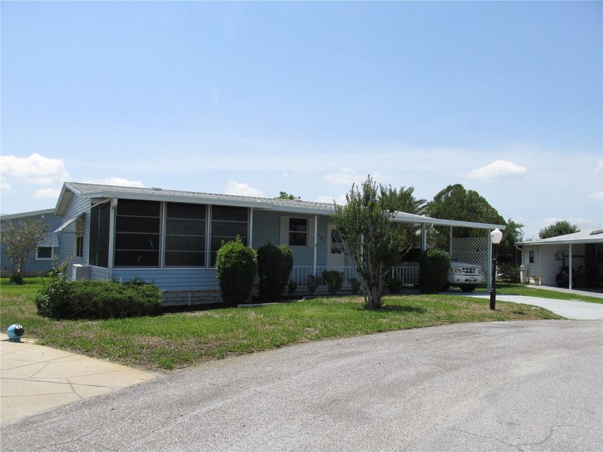 This small but lovely little home will make a great Winter Home in this sunny and active 55+ community.  All furnished with the exception of a TV, and ready to move into.  Nice size lanai without A/C, facing the front of the property.  No gray pipe plumbing, with inside laundry in the 
hallway. The eat in kitchen is very convenient for leisurely coffee and conversation. The roof was installed in 2023.  A/C is older but has been serviced annually and well maintained and still works well. Dishwasher is new. The golf cart that comes with the house was refurbished in 2024. Larger shed for storage.