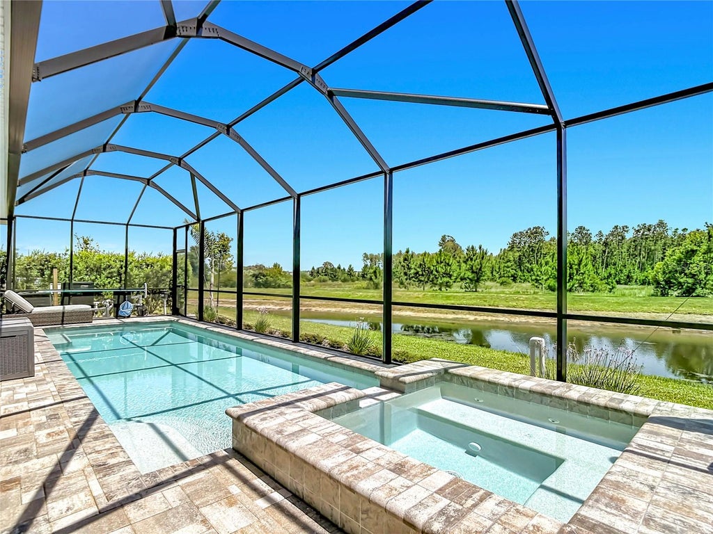 Photo of 7677 Broad River Avenue, Land O Lakes, FL 34638 (MLS # TB8517771)
