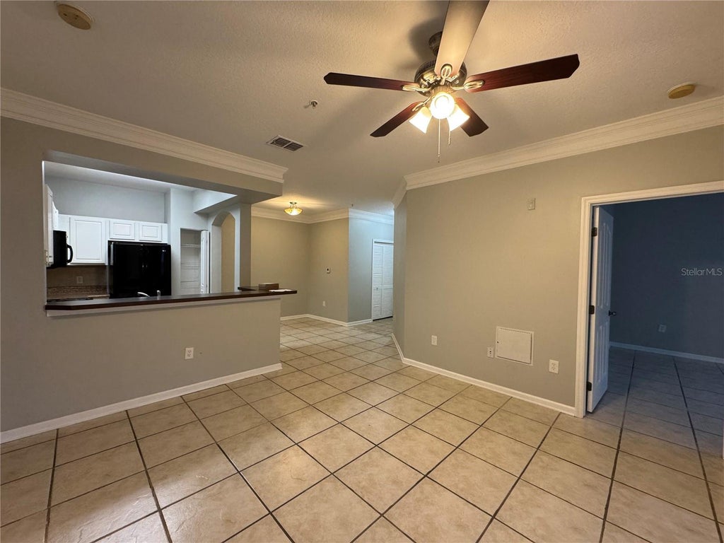 Photo of 12831 Madison Pointe Circle #104, Orlando, FL 32821 (MLS # O6438012)