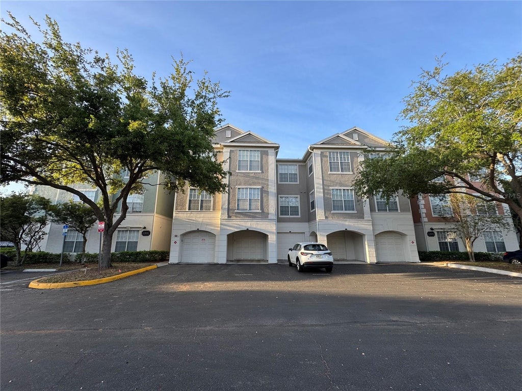 Photo of 12831 Madison Pointe Circle #104, Orlando, FL 32821 (MLS # O6438012)