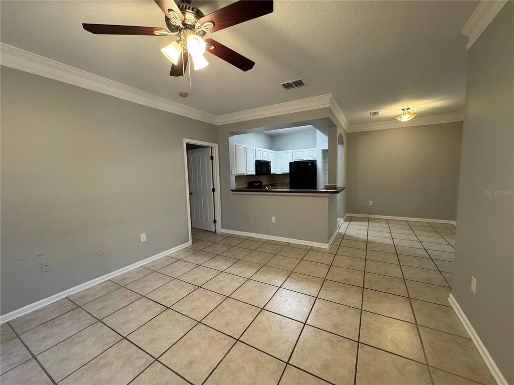 Photo of 12831 Madison Pointe Circle #104, Orlando, FL 32821 (MLS # O6438012)