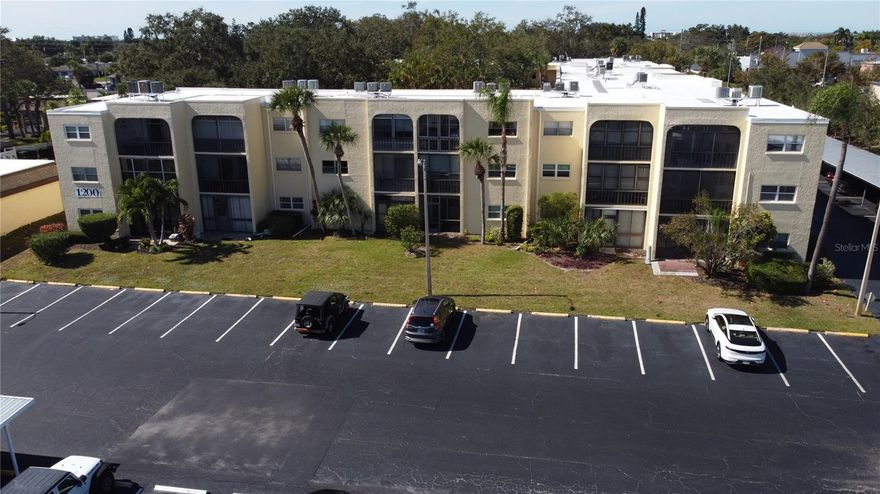 Welcome to this inviting first-floor condo in the popular Water’s Edge Condos nestled in the heart of Largo. This comfortable 2-bedroom, 1½-bath home offers approximately 840 square feet of living space, with a flexible layout that accommodates everything from full-time living to seasonal getaways. Situated on the ground level, the unit provides easy access without stairs while remaining part of a well-maintained three-story community that welcomes residents of all ages.
Living here gives you access to a full suite of resort-style amenities: a heated pool and spa, a large clubhouse with fitness center and gathering spaces, shuffleboard and cornhole courts, a lakeside gazebo and dock for relaxing or fishing, elevator access and laundry on each floor, and on-site assigned parking. 
 The community’s location is a standout—just minutes to the white sandy beaches of the Gulf, a short drive to shopping, dining and public transportation, yet tucked into a peaceful lakeside setting that feels like a retreat. This unit is offered at a compelling price point that reflects strong value in the area.
If you’re seeking a home that combines lifestyle, convenience and a smart investment in one of Pinellas County’s desirable communities, this condo at Water’s Edge is well worth your consideration.