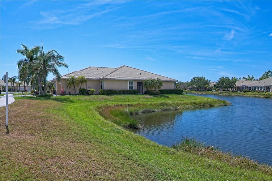 Seller will pay $5000 to pay down points/closing costs with acceptable offer. You Found it!  Immaculately Maintained 2 Bedroom, 2 Bathroom Villa with Den and a 2 Car Garage.  End Villa with privacy and fabulous wrap around lake views.  Double Doors to the Den or Hobby Room which could also be a 3rd Bedroom for Guests.  The Kitchen boasts tall wood cabinets, granite counters and breakfast bar, stainless appliances and recessed lighting.  Inside Laundry with Washer and Dryer and Utility Sink for convenience.  Split Bedrooms for additional privacy.  The Spacious Main Bedroom to the rear of the home offers a lake view, and can accommodate a King Size Bed. Generous His n' Hers Walk-in Closets.  The Main Bathroom has a large shower and double vanities. The Great Room has sliders out to the screened Lanai with a serene view of the lake.  Washer & Dryer 2 yrs old, A/C May 2021, Refrigerator and Dishwasher replaced 2022.  Talon Bay is a private gated community offering an active lifestyle with a Clubhouse, Fitness Center, 3 comfortable socializing areas including Library, tennis/pickle ball courts, shuffleboard and a whole array of activities to enjoy with family or friends.  Oh, and did I mention the large, heated pool overlooking one of the 6 community lakes?  In total 15 acres of nature preserve to enjoy plus a Kayak/Canoe launch to the Myakka River.  The Association takes care of the grass, shrubs and exterior of the Villa, and Cable.  Offered Turnkey Furnished - Don't Wait!  Book to see your new home TODAY!