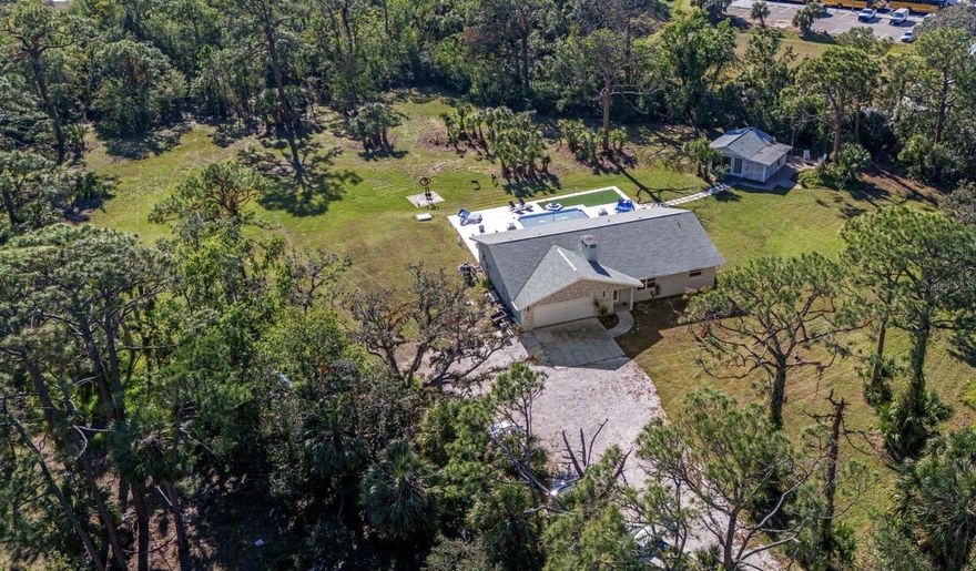 One or more photo(s) has been virtually staged. Upon passing the gated pillars of the winding driveway you come upon a hidden treasure. 2.5 Acres of beauty tucked away just off Tamiami and Bay in Osprey. This property backs up to the renowned Pine View school grades 2-12. One of the finest schools in the state and country.                                                                                        

 

The peace and tranquility of the outdoor space is highlighted by a resort style swimming pool 40 x10 and attached 25x13 swim shelf with infinity edge, Bubblers, waterfalls, fire balls and 2400Sqft of entertainment area, including a 4 hole putting green, 

The totally remodeled home has NEW, NEW and NEW,

Three A/C’s,

Plumbing Water hot and cold,

Sewer and Drain lines,

Septic, The new septic unit has enough capacity for an additional bathroom,

Roof home and Casita,

Ceramic tile though out,

Hurricane windows and doors 6 French doors opening to backyard pool area,

 Polyaspartic flooring in garage,

Stack stone,

Samsung top line kitchen appliances with Bluetooth and Wi-Fi,

Soft close custom cabinets, Kitchen, Pantry and bathrooms,

The open floor plan is ideal for entertainment with the woodburning fireplace to the twelve-foot ceiling. The layout of the three bedrooms is split with two bedrooms on one side and the primary bedroom on the other side of the house. The casita is the perfect spot for guests, the nanny or grandma. It boasts a kitchenette and ¾ bath, both a screened in attached patio and a deck for you to read or write your novel.

There is plenty of room for your horse or cows our to plant a garden and set up a chip and putt golf course.
Now Priced below appraised value