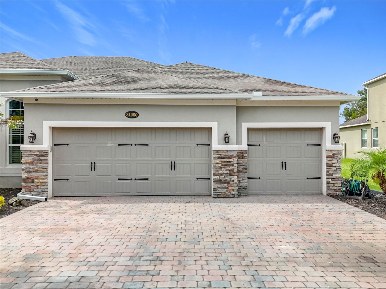 Your dream residence awaits in the charming, gated community of Serenity at Redtail. Located in charming Sorrento, this home provides a serene escape from the hustle and bustle, while still being close to activities and shopping in Mount Dora, Sanford and Orlando. Neighborhood is located less than a mile from the Wekiva end of SR 429 to add ease of travel to anywhere in greater Orlando. This subdivision neighbors exclusive Red Tail with memberships available for golf, tennis, community pool, workout center and restaurant. With double paned windows and superior insulation qualities, the last 18 months of power bills averaged only ~$232 per month. Mature trees and beautiful landscaping will invite you in. You'll be greeted by 12' ceilings creating an open airy ambiance. This spacious floor plan creates a seamless flow throughout the home. The living areas boast elegant finishes like 8' interior doors, 3.25" baseboards, and custom crown molding. Notice the abundance of natural light with a 4-panel sliding glass door that opens to a spacious +/- 1062 SF back patio with pergola. The spacious family room is the perfect place to entertain or relax. Large built in entertainment center for movie enjoyment. The modern kitchen features top of the line KitchenAid appliances, 42" cabinetry, and an oversized center island that serves as the heart of this space. Kitchen features tiled back splashes, under cabinet lighting, walk-in pantry, and coffee bar. The double doors open to a large master suite complete with custom tray ceiling, lighting, and two walk-in California closets. The ensuite bath features a soaking tub, oversized walk-in shower with dual shower heads and vanities.
