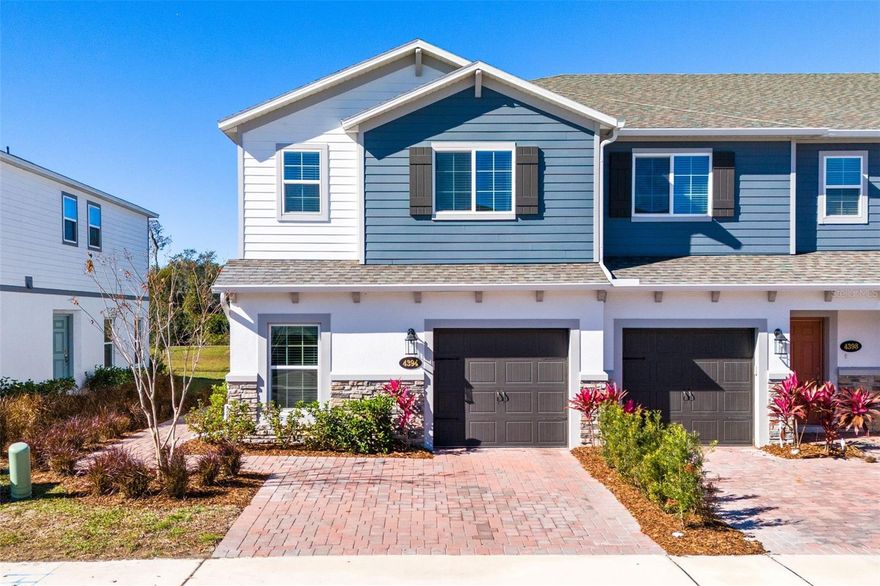 Welcome to this pristine 2023-built END-UNIT townhouse at 4394 Campsite Loop, where modern comfort meets peaceful POND VIEWS—with no rear neighbors to steal your sunset. Just under 1,800 square feet, this 4-bedroom, 3 full bath home features a first-floor bedroom, ideal for guests or a home office, plus an upstairs loft perfect for work, play, or movie nights. The open-concept main level showcases LVP flooring throughout, a bright great room and kitchen combo, and a chef-ready kitchen with QUARTZ countertops, stainless steel appliances, and custom cabinetry—everything you want, nothing you don’t. Upstairs, the spacious primary suite delivers a luxury bath with dual sinks, walk-in shower, and walk-in closet. Step out back to a screened patio overlooking the pond, a quiet retreat after a long day. Built with efficiency in mind, this home is 100% Energy Star 3.1 certified, featuring R-38 ceiling insulation, radiant roof barrier, Low-E double-pane windows, and Energy Star appliances—comfort that’s easy on the wallet. All of this just minutes from Lake Nona, where convenience, innovation, and lifestyle collide. Clean lines, smart design, and pond-side peace—this one checks all the boxes (and then some).