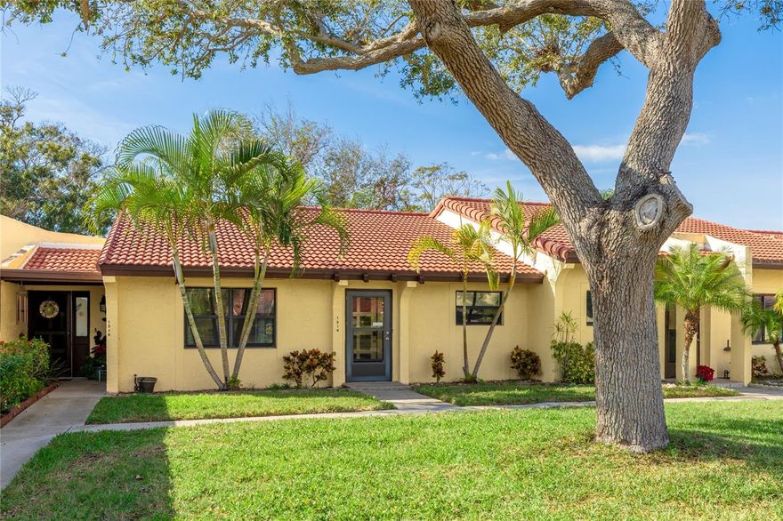 ~ MEADOWCROFT ~. Take advantage of the lifestyle offered with this beautiful immaculate condominium in this 55+ community where you can live maintenance free and enjoy shopping, dining, the YMCA, GT Bray Park right down the street and Bradenton's beautiful beaches ..  all so conveniently closeby.  This one floor condo has been lovingly maintained and well appointed and conveys TURNKEY furnished.  Tile 18 x 18 flooring can be found throughout with laminate flooring in the bedrooms. This lovely home has is full of features and upgrades that include Frigidaire Gallery stainless steel appliances, granite countertops, vaulted ceiling, a breakfast bar, a window overlooking the front from your kitchen sink, Thomasville wood kitchen cabinetry, tile backsplash, a 5 burner range, crown molding, French doors opening to the enclosed lanai, fans, oversized interior doors, customized closet shelving, ceiling fans, textured ceilings and remodeled attractive bathrooms.  The Dining Room and Living Room area is generously sized at 30 x 14. The Primary bedroom overlooks the backyard and has been appointed with a large walk in closet complete with cabinetry already in place.  The lanai, which is tiled, faces the West so you'll be able to enjoy the afternoon sun. Additional features include a 2023 A/C, tile roof, large storage closet, interior hallway laundry room and a hallway storage closet.  There's plenty of guest parking available with your personal covered parking just steps away that includes another storage closet for your extras.  The Clubhouse offers a kitchen, dance floor, TV, piano, library and billiards table. The gated heated pool is private and includes a spa overlooking a beautiful lake where you can catch and release fish which is available to residents only.  Your $651 monthly fees cover water, trash, sewer, cable tv, Wi-Fi, a Property Management company & community amenities. Extras include a gazebo,  shuffleboard, tennis and pickleball providing plenty of opportunities to socialize and make new acquaintances.  This could be your new home!