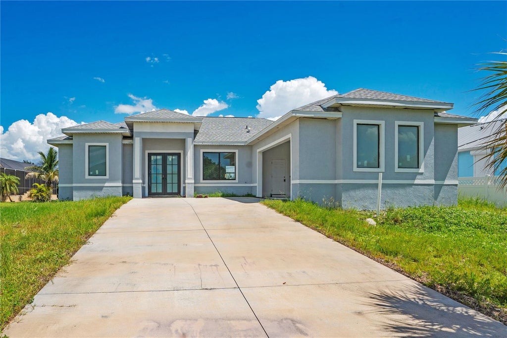 Photo of 10658 Rainsville Street, Port Charlotte, FL 33981 (MLS # O6441689)