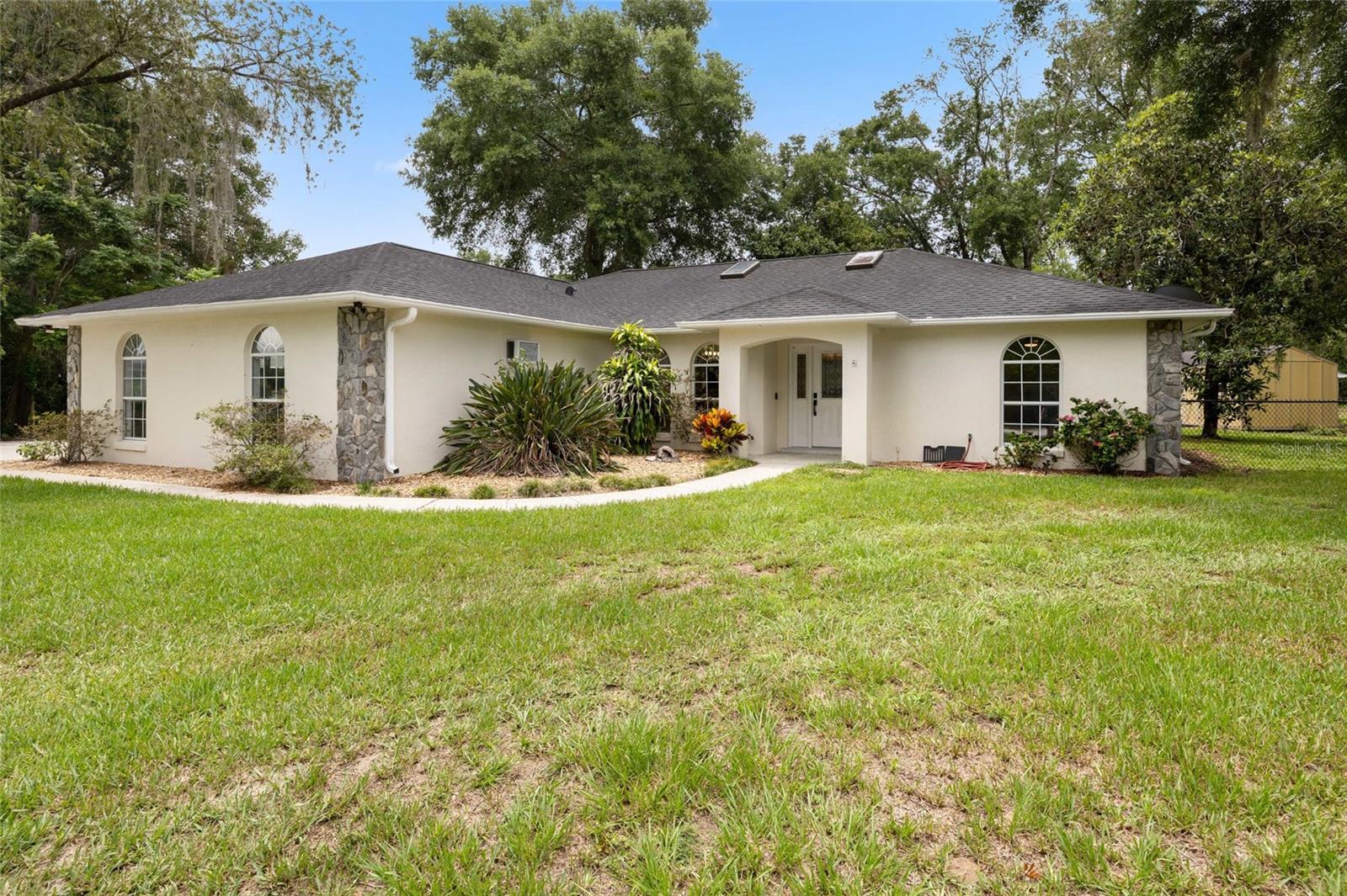 NO HOA! ON AN EXTRA SPACIOUS LOT OF .59 ACRES. This rustic home is situated in Belleview with a short drive of about 10 minutes to the villages and 20 minutes to Ocala. With lots of storage and parking for all your toys and equipment. Split floor plan an additional Florida room. This home has a breakfast nook and an additional formal dining area. Seller will offer assistance with closing costs for buyers with a competitive offer. This 3/2/2 is move in ready.