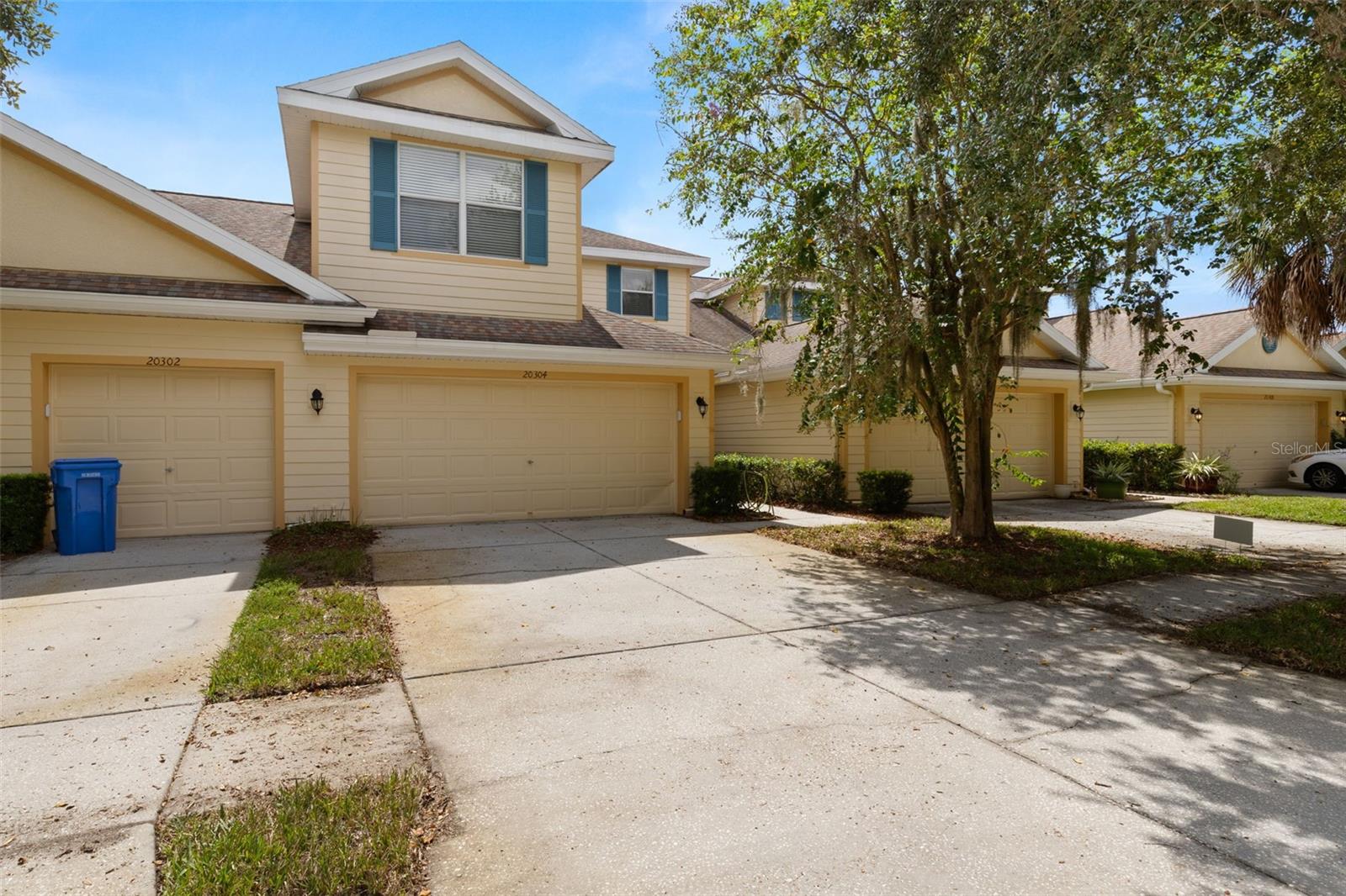 Pristine townhome located in the highly desirable gated community of Live Oak Preserve in New Tampa. This spacious and light-filled home features 3 bedrooms, 2 full bathrooms, 1 half bathroom downstairs, and a 2 car garage. The welcoming foyer opens to a large great room and adjacent dining area that is perfect for entertaining. The kitchen boasts maple cabinetry, a breakfast bar, Kohler double basin enameled cast iron sink, and Whirlpool stainless steel appliances. Washer and dryer are included. Ceramic tile flooring throughout the first floor and two sets of 8-foot sliding glass doors provide a bright and open feel. Upstairs, the primary suite offers hardwood floors, a generous walk-in closet, and a beautifully appointed en suite bathroom with dual sinks and a walk-in shower. Two additional bedrooms provide ample space for family or guests. Enjoy maintenance-free living with exterior structure maintenance, lawn care, landscaping, trash, and irrigation included in the rent. Live Oak Preserve offers resort-style amenities including a 24-hour manned gate, community pool, clubhouse, tennis courts, fitness center, and playgrounds. Conveniently located near fabulous restaurants, shops and entertainment. Don’t miss this opportunity to live in one of New Tampa’s premier communities!
