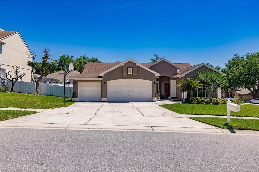 One or more photo(s) has been virtually staged. Welcome to this beautifully updated four-bedroom, three-bathroom home located in the highly desirable city of Ocoee, known for its family-friendly atmosphere, convenient access to Orlando, nearby parks and trails, and quiet suburban charm. Nestled in a peaceful neighborhood just off Lake Olympia, this exceptionally decorated home offers the perfect blend of comfort, style, and location. From the moment you enter, you’ll notice the soaring vaulted ceilings, abundant natural light, new floors, and a warm, newly renovated fireplace that creates an inviting focal point for the living space. The updated kitchen features stainless steel appliances, upgraded cabinetry, and a functional layout perfect for everyday living or entertaining guests. The spacious primary suite includes a beautifully updated master bath with a modern walk-in shower designed for both comfort and style. Step outside to enjoy the spacious, meticulously maintained lawn and relax in the serene outdoor setting.  Additional highlights include solar panels for energy savings and an ideal location close to SR 408 and the Florida Turnpike, offering quick access to Downtown Orlando, Winter Garden, shopping, dining, and major employment centers. Residents love the area for its quiet residential feel, strong sense of community, diversity, and proximity to outdoor recreation including the nearby West Orange Trail. This home truly offers the opportunity to enjoy peaceful suburban living while staying connected to everything Central Florida has to offer.