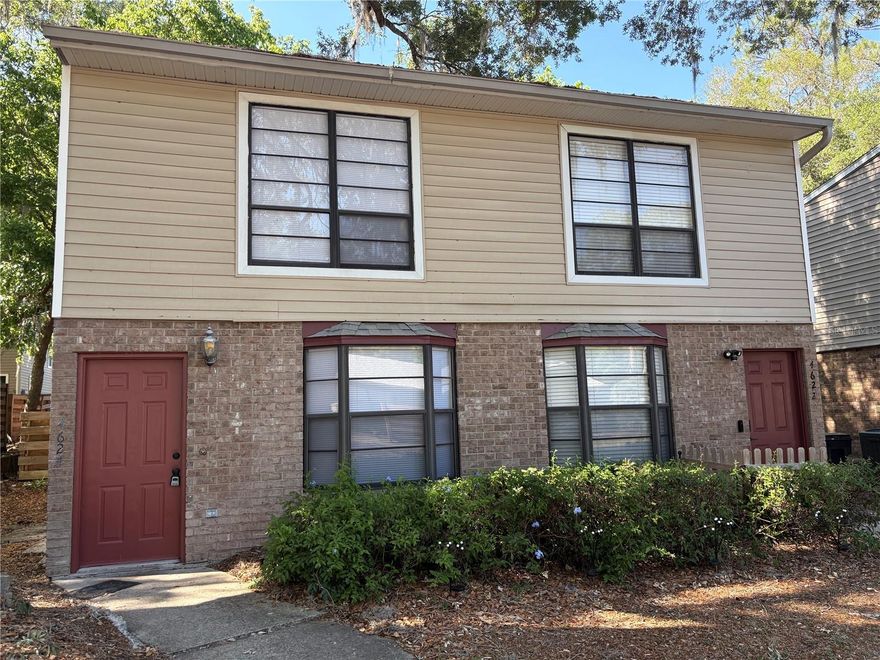 One or more photo(s) has been virtually staged. This Duplex style Townhouse is  centrally located in Gainesville minutes to Celebration Point and Butler Plaza, University of Florida, Shands and HCA Hospitals, VA.
Newly painted interior, new flooring throughout and new bath/shower surrounds in 2 bathrooms. With a large wood deck and patio area perfect for entertaining or enjoying a quiet morning. This townhouse is a Must See!