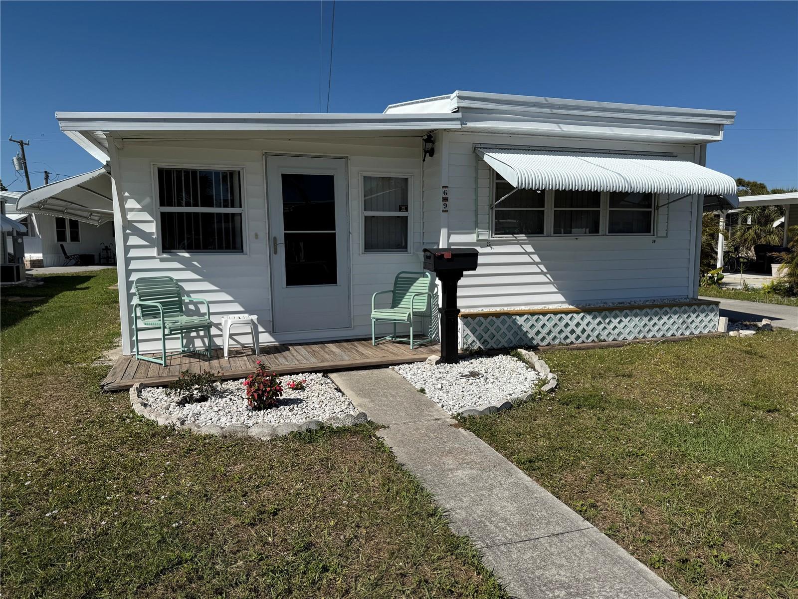 Where else can you find an affordable beach getaway location for this price! This lovely unit has 1 bed and bath in the main home and a bedroom for company along with a large family room in the addition. The unit is adorably decorated, open and airy. The eat in kitchen has been completely redone - any and all maintenance on the home kept up. A brand new powerful Mini split system keeps the entire unit cool! The roof is new and the Carport - a huge 19 by 35 feet was just installed and done with the latest in storm safety in mind. The pool area , bathrooms and laundry room are Just steps away across the street! No hassle with worries on water hoses or electric use for laundry! Brook to Bay is an over 55 park with a constant flow of activities and trips planned for the residents- you can be as involved as you want or just enjoy the park and the beautiful pool area- a ramp to launch for small boats that leads right to the inter coastal- only 10 min drive to the beaches….This is paradise!!!