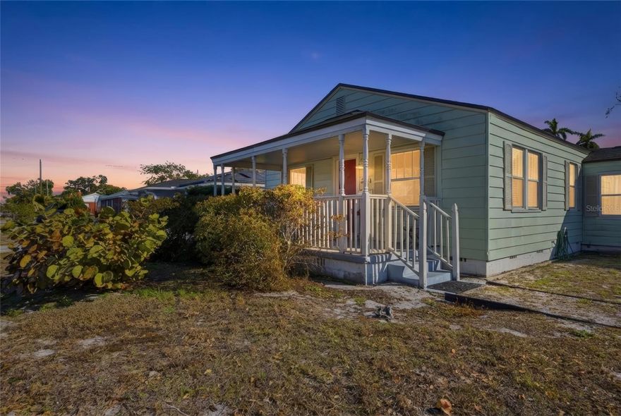 Greetings from sunny Gulfport — where the breeze feels softer, the colors feel brighter, and life moves just a little slower. Welcome to your bungalow by the beach. 
Just one mile from the sparkling waterfront, this circa 1945 “Old Florida” charmer tells a story the moment you arrive. A cozy covered porch sets the scene, and then — that magenta front door. Bright, happy, unforgettable. It swings open to reveal original hardwood floors, plantation shutters, classic wainscoting, mosaic tile accents, and a surprisingly open layout that feels airy and effortless for a home of this era. The living room flows naturally into the kitchen, with space for a full dining table where friends linger a little longer and dinners turn into memories.
To one side of the home, you’ll find two inviting bedrooms and a full bath — tucked away and peaceful. On the other side, a step-down bonus room offers flexibility and possibility: home office, media lounge, guest retreat, or even future conversion into a multi-generational suite or income-producing space with the garage. It’s the kind of layout that adapts to your story.
Step outside and the mood shifts to lush and green. Bamboo sways in the breeze, mango and palm trees frame the yard, just shy of a ¼-acre lot — a rare find this close to the coast — gives you room to dream big. Boat, RV, pool, gardens, entertaining under the stars… there’s space for it all. No HOA. No CDD. No flood insurance. Just the freedom to live creatively in Gulfport’s beloved Art District.
Here, mornings begin with beach walks and salty air. Afternoons are spent wandering galleries and local markets. Evenings bring sunset celebrations on the pier, waterfront dinners, and live music drifting through town. You’re minutes to the marina, boat and kayak launch, and quick access to I-275 — close to downtown St. Pete and the airport, yet still feeling like your own tucked-away coastal escape.
A little nostalgic. A little salty. Fully, joyfully Gulfport.
Come step inside and feel the sunshine for yourself.