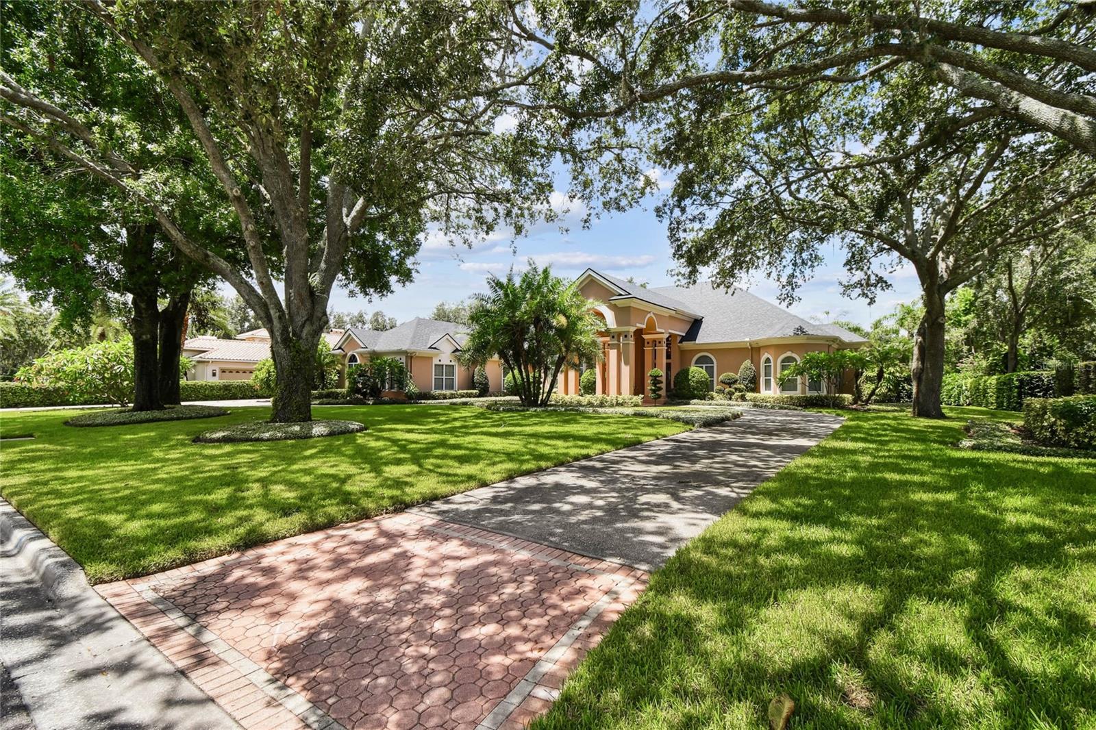 Experience the ultimate in luxury living with this exceptional rental opportunity in Avila—Tampa Bay’s premier guard-gated golf and country club community. This impeccably maintained residence offers 5,553 Sq Ft, 4 Ensuite Bedrooms, 5 Full and 1 Half Bathrooms, a private Home Office, Bonus /Movie Room, 4-car garage, and a stunning screened-in pool and spa designed for year-round enjoyment. The thoughtfully designed floor plan features all main living areas on the first floor, with the bonus/movie room privately situated upstairs. Upon entrance you will find the formal living and dining rooms—perfect for entertaining—complete with an adjoining wet bar and wine storage. The updated chef’s kitchen boasts premium stainless steel appliances, including an induction cooktop, double ovens, and a charming kitchen dining area. The kitchen flows seamlessly into the inviting family room, where a fireplace and custom cabinetry create a warm and refined gathering space. The private home office offers an ideal work-from-home setting, complete with custom cabinetry and a built-in desk for a polished, functional workspace. The primary suite is a serene retreat, featuring dual walk-in closets and a spa-inspired bathroom with double vanities, a soaking tub, and a separate glass-enclosed shower. Three additional bedrooms are found on the first floor and provide plenty of living options for family and guests. Upstairs you will find the Bonus/Movie Room complete with a pool table, movie screen and projector. This is the ideal place to relax and enjoy your favorite movies and play pool. Your outdoor oasis is beyond compare and includes a screened in pool and spa and an outdoor kitchen. This home is ready for immediate occupancy.